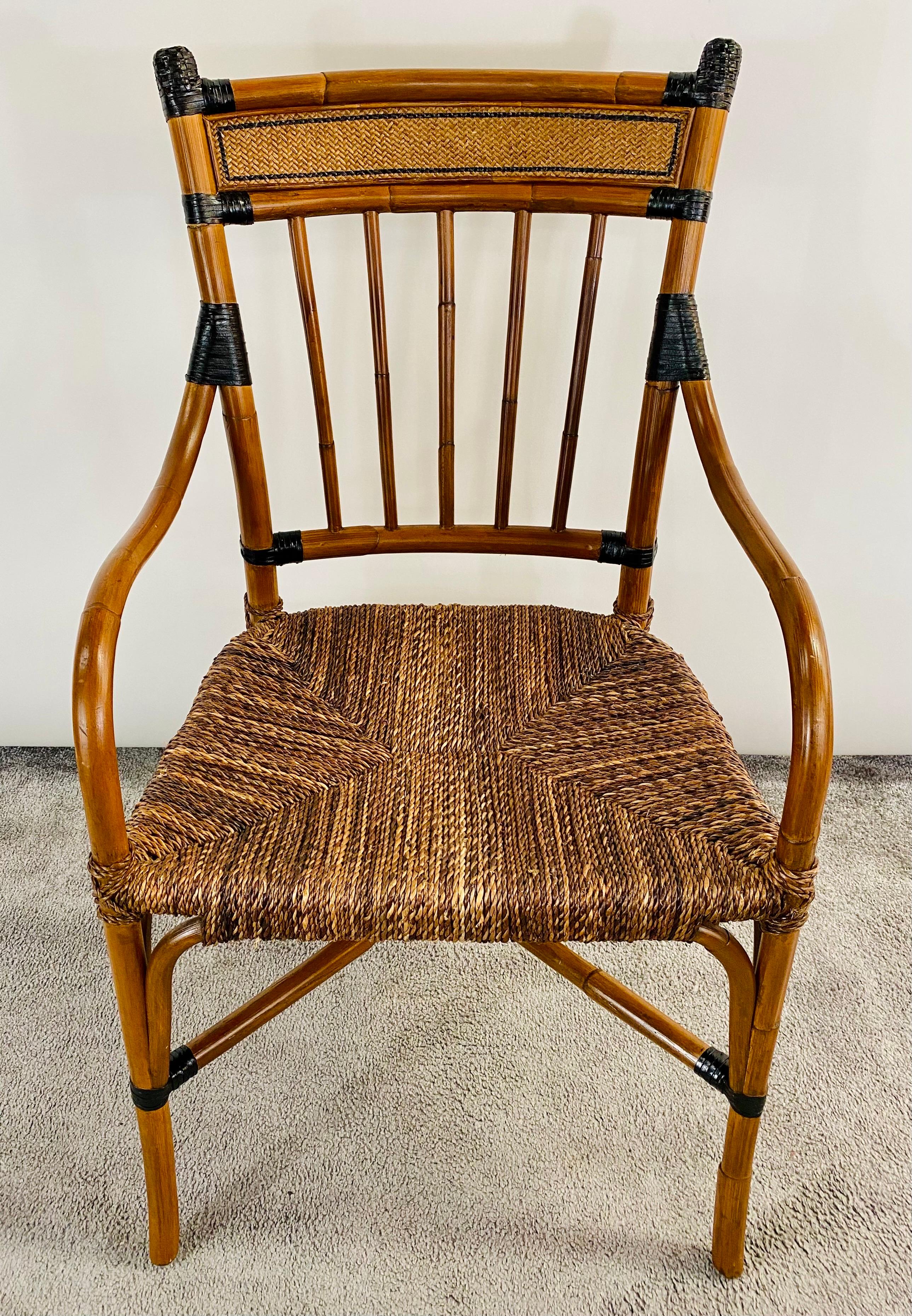 A quality Mid Century Boho Chic faux bamboo and Rattan armchair. Finely carved , the chair features curved arms resting on a rattan seat. The back of the chair is slightly curved providing additional comfort and embellished with rattan and black