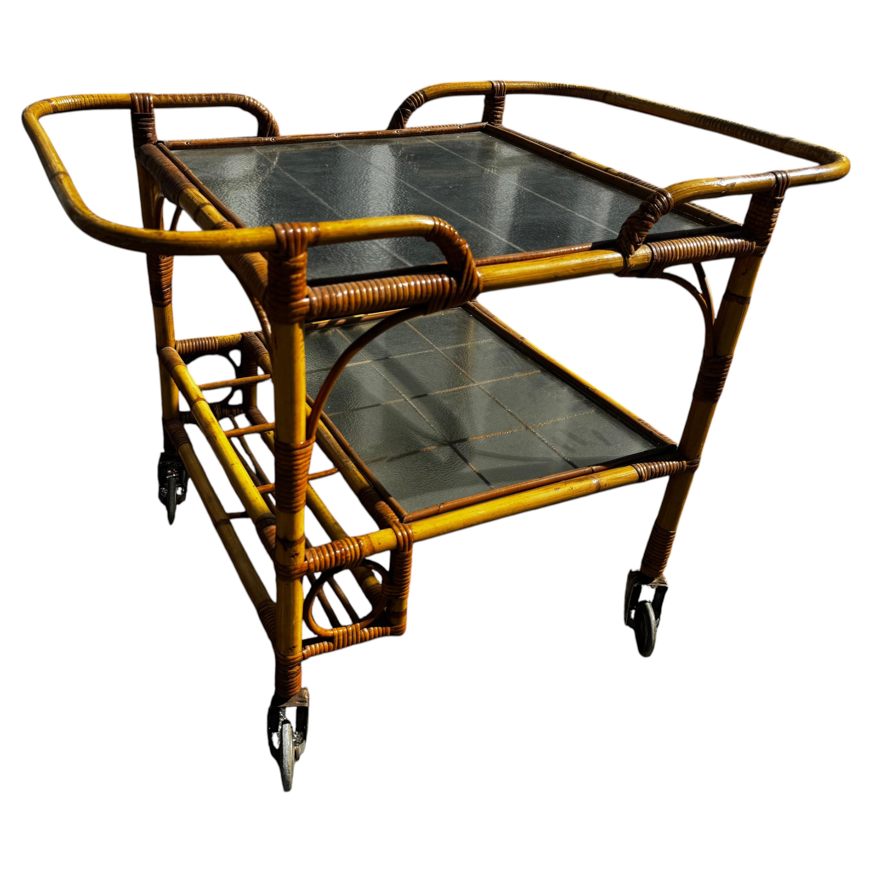 Mid Century Boho Chic Tiki Bamboo and Glass 2 Tier Rolling Bar Cart For Sale