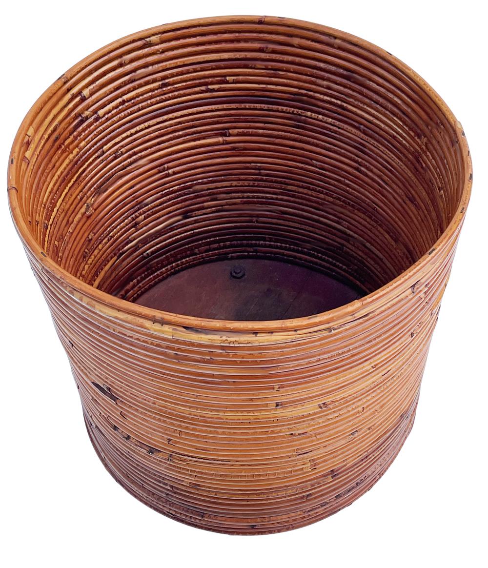 Bohemian Midcentury Boho Modern Rattan Planter or Waste Basket on Casters For Sale