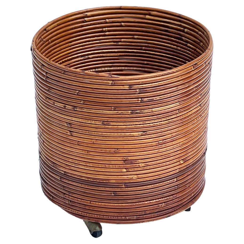 Midcentury Boho Modern Rattan Planter or Waste Basket on Casters For Sale
