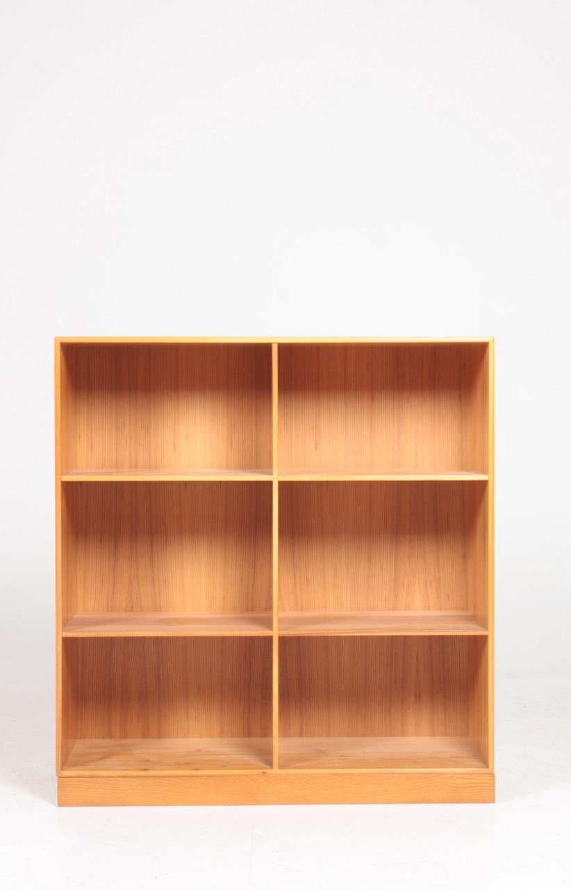 Bookcase with loose base, solid elm designed by Mogens Koch for Rud. Rasmussen cabinetmakers in 1933. Made in Denmark and in great condition.