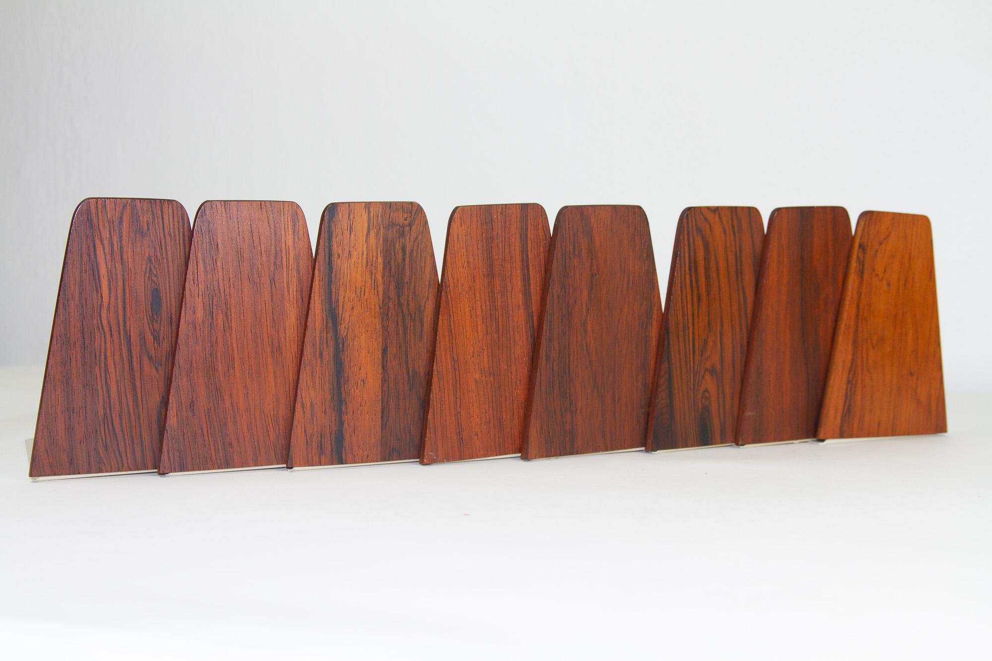 Mid-century bookends by Kai Kristiansen for FM 1960s, set of 8.
Very decorative Danish modern bookends in rosewood and metal designed by Danish designer Kai Kristiansen for Feldballes Møbelfabrik. Made as a supplement to FM Reolen wall unit