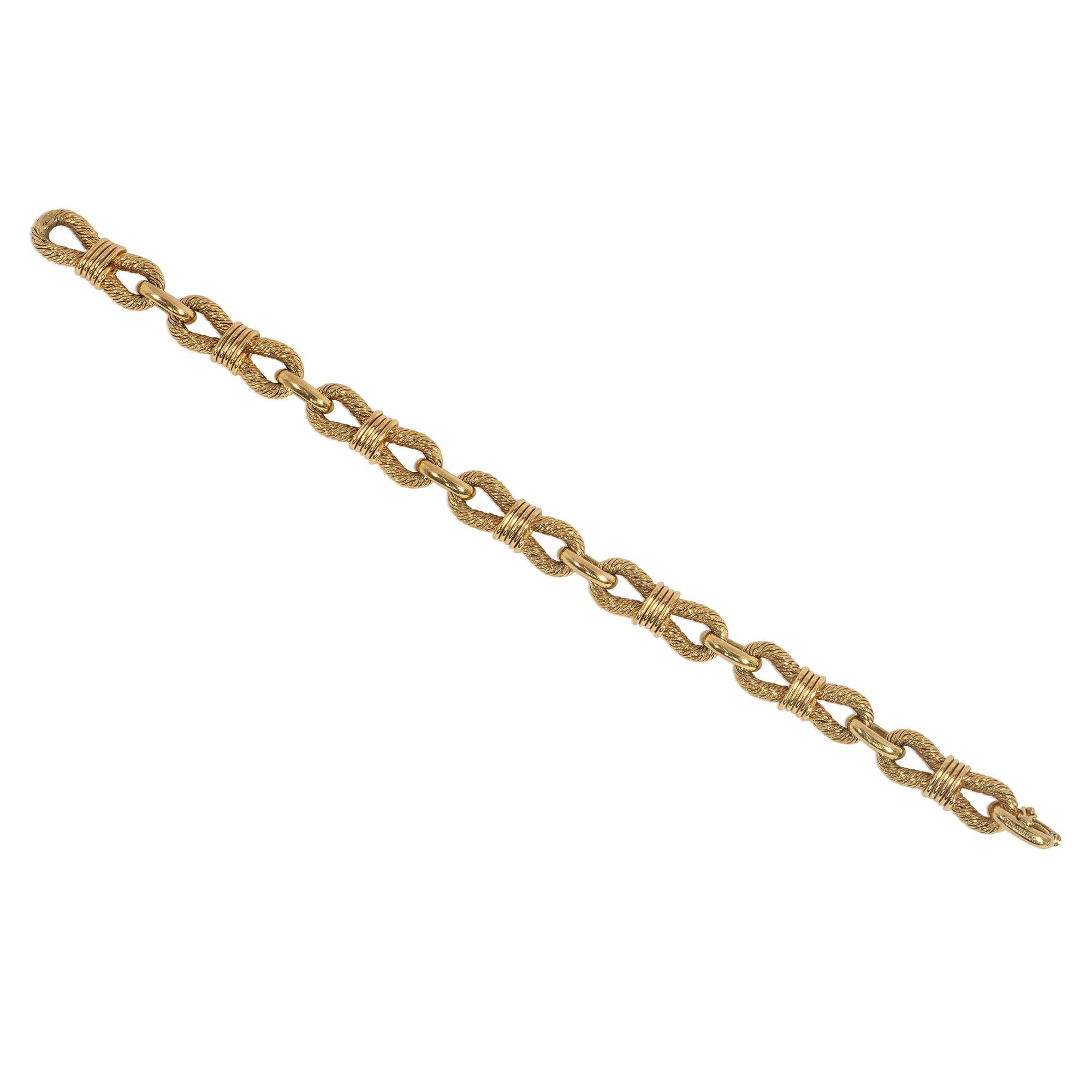 A mid-century gold nautical motif bracelet comprising woven gold figure-8 shaped links of cinched rope design, in 18k. Georges Lenfant for Boucheron, Paris.

* Includes letter of authenticity for insurance purposes
* Free shipping
* Please do not