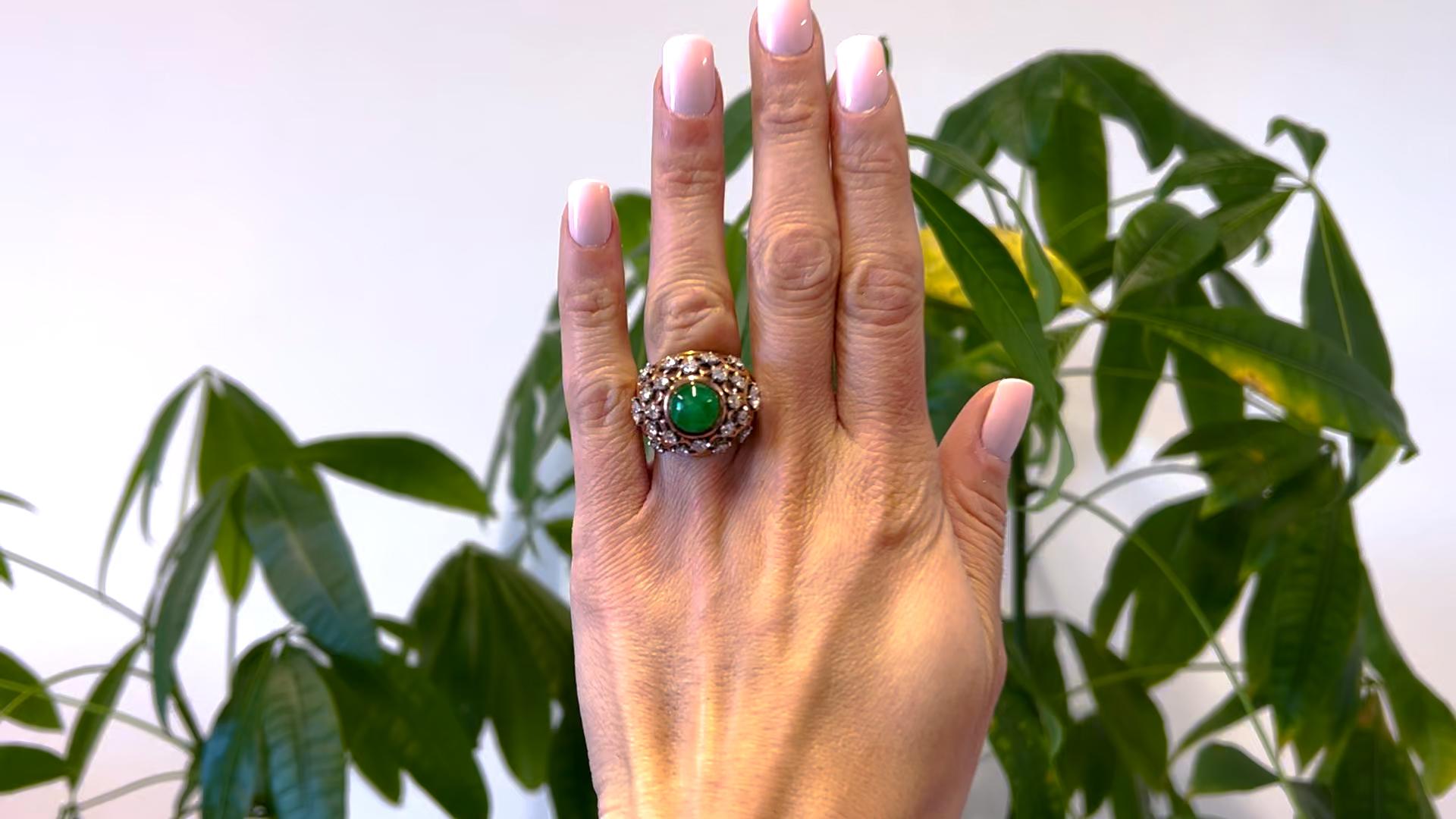 One Mid Century Boucheron Paris Jadeite and Diamond 18k Gold Bombé Ring. Featuring one cabochon cut jadeite weighing approximately 4.65 carats. Accented by 22 old European cut diamonds with a total weight of approximately 3.60, graded colorless,