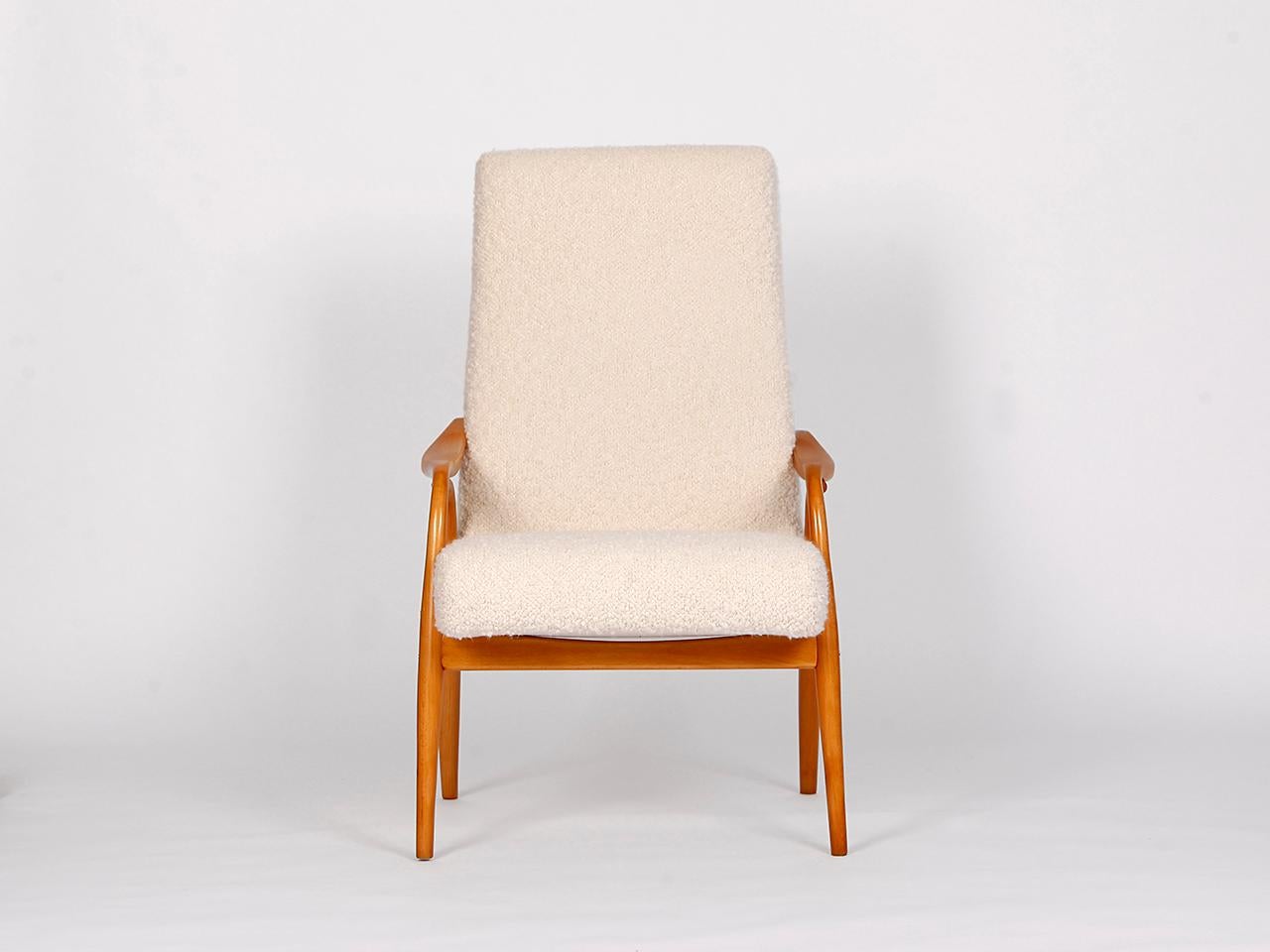 Mid century Boucle armchair by Antonin Suman for Ton, from the 1950s, manufactured in former Czechoslovakia. Newly varnished wooden parts, solid coconut fiber upholstery. Fully restored. With a wonderfully soft english cover boucle fabric made of