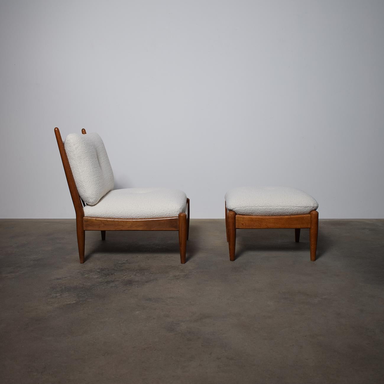 Beautiful French Oak Chair With Matching Ottoman, 1960s 
Newly reupholstered with soft white Bouclé Fabric.
Price shown is for the chair including the ottoman
Additional dimensions information:
Ottoman Height 37 cm x W54.5 cm x Depht 54.5 cm


