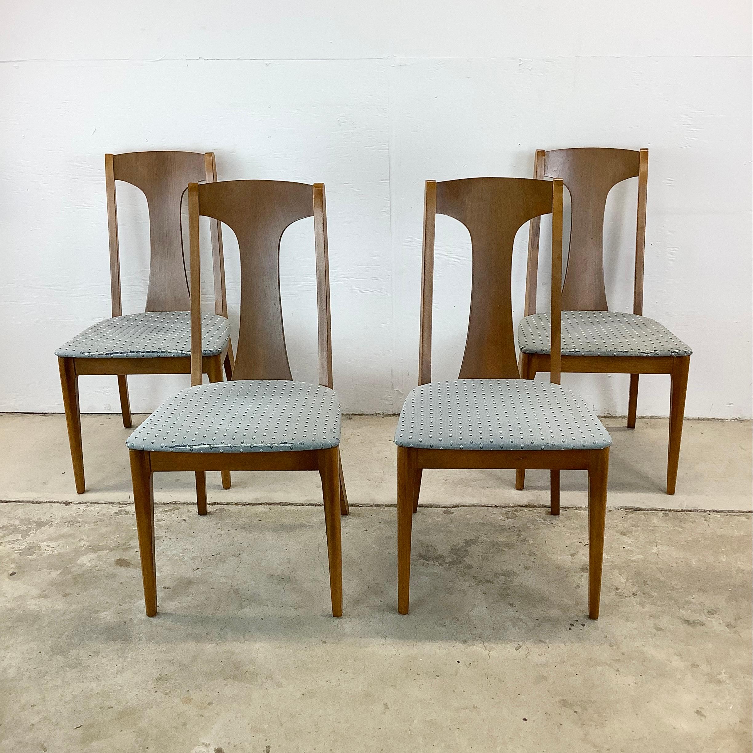 Step into retro style with this set of four Mid-Century Walnut Dining Chairs from Kroehler Furniture, crafted in the style of the iconic Broyhill Brasilia collection. Each chair is a testament to the era's love for sleek lines and warm walnut