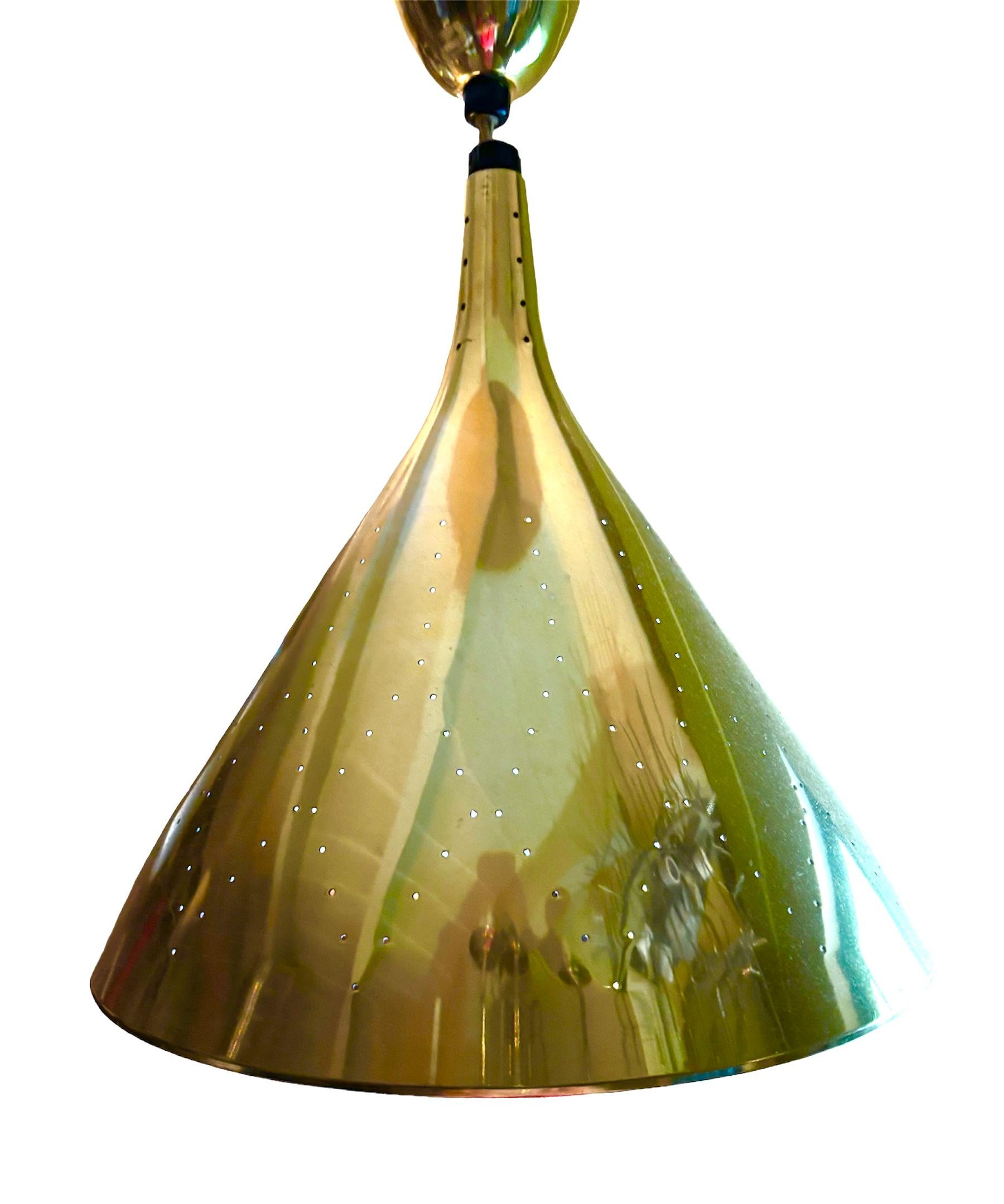 Fabulous Pull-Down Space Age Modern conical perforated Brass pendant light in the style of Gerald Thurston’s designs for Lightolier  With its adjustable cord, discreetly hidden inside the bulbous brass contraction,  is the perfect light source over