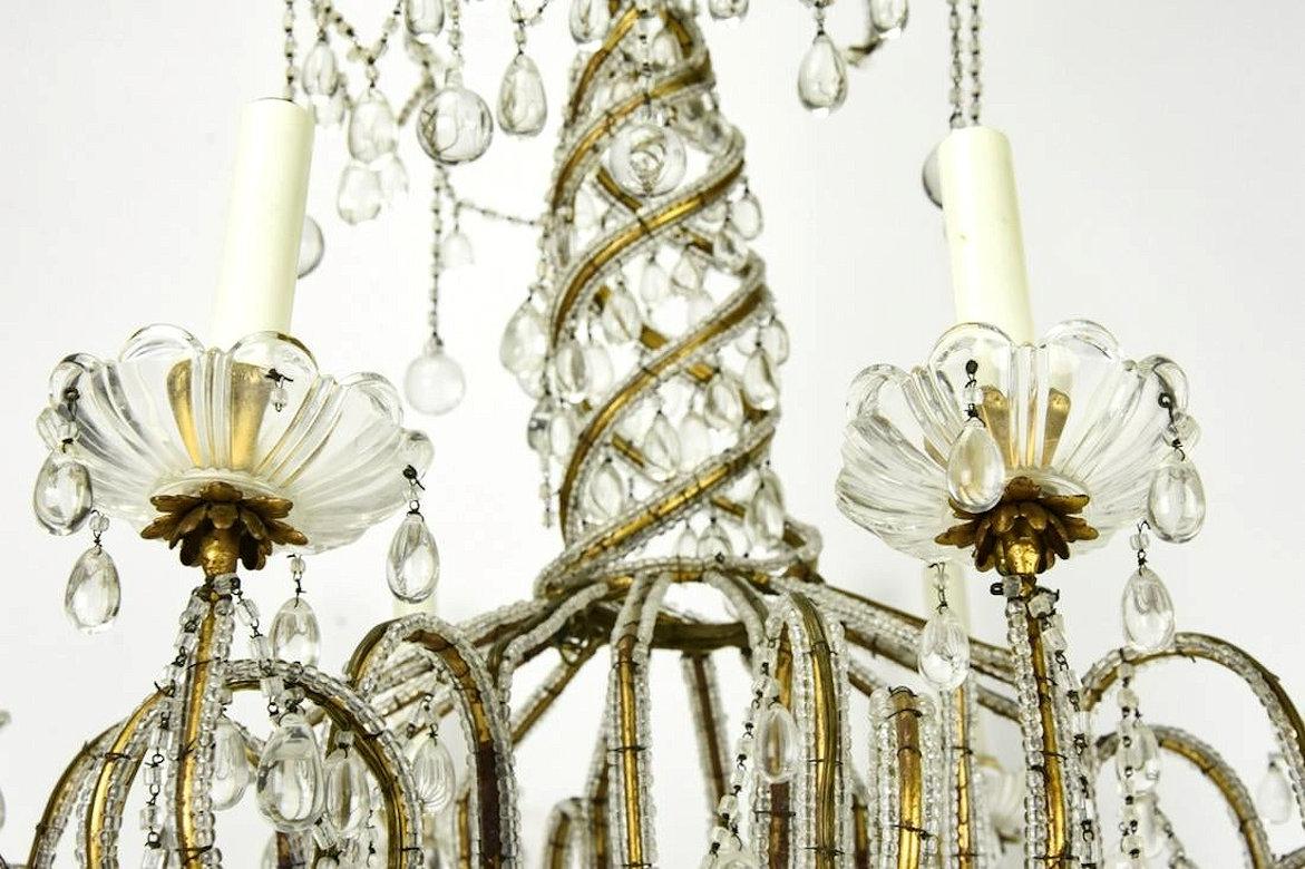 French Midcentury Brass and Beaded Crystal 8-Light Chandelier Attributed to Baguès For Sale