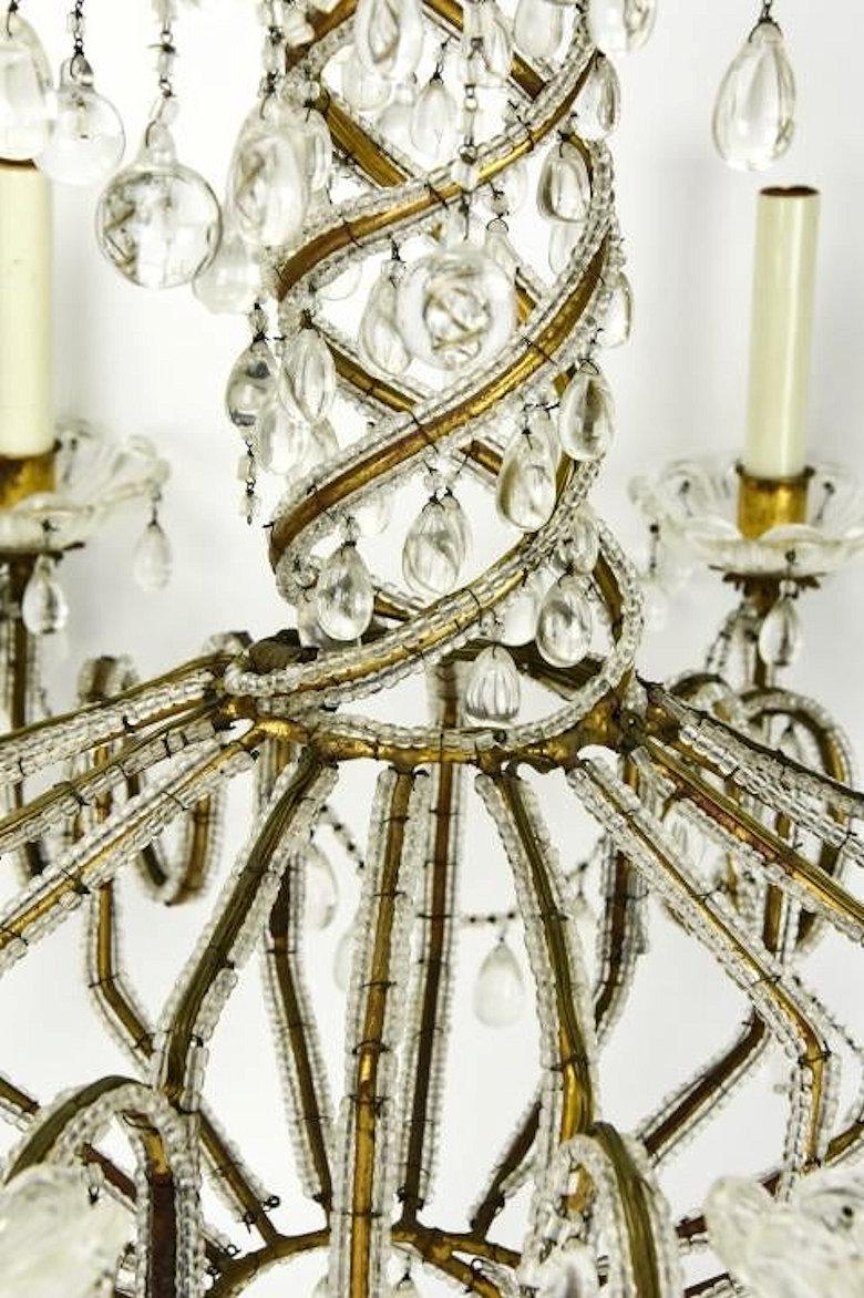 20th Century Midcentury Brass and Beaded Crystal 8-Light Chandelier Attributed to Baguès For Sale