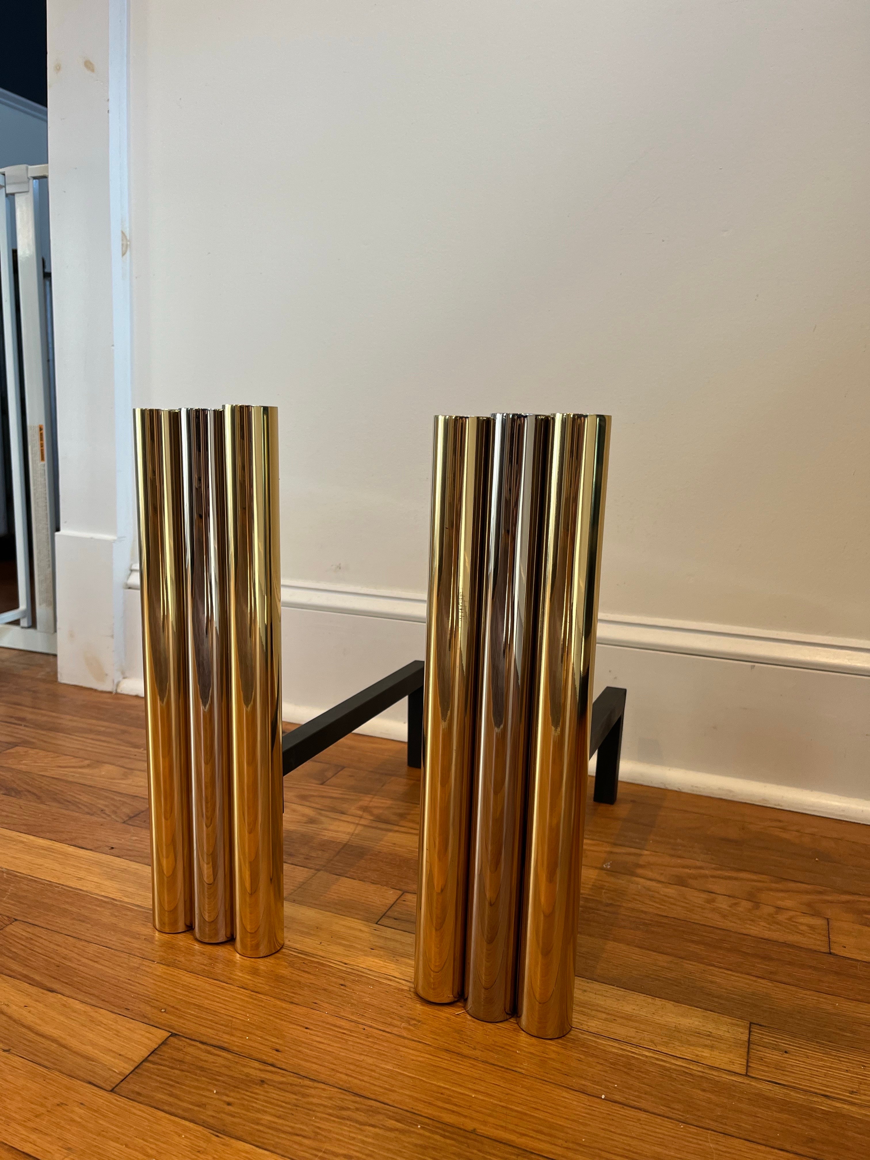 Stunning tubular andirons in brass and chrome. 3 substantial columns with 2 brass flanking 1 chrome. Chic and sophisticated in the manner of Alessandro, Springer, Adnet.
Beautifully polished.
