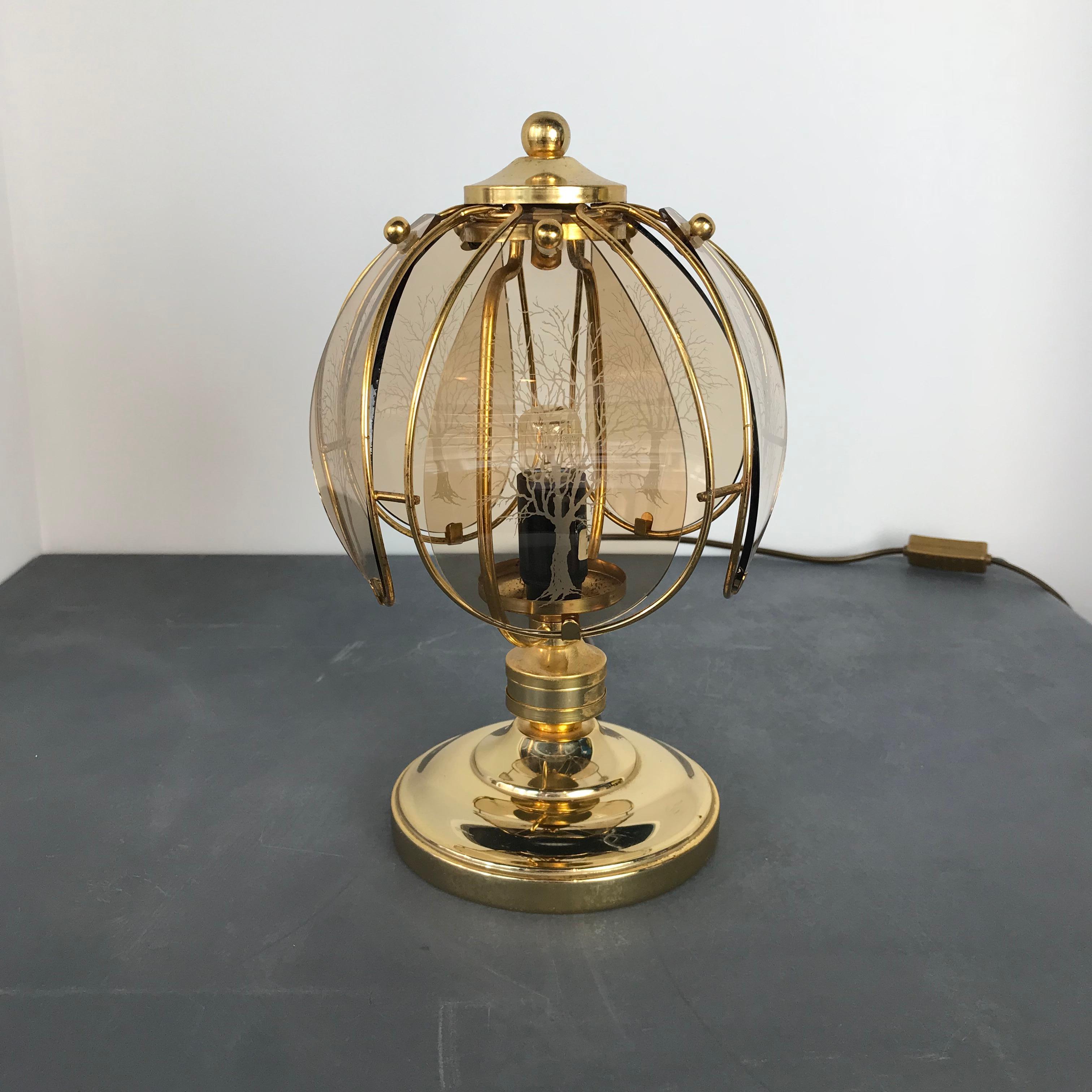 Rarity, this Wortmann & Filz, vintage brass table lamp with etched art glass from the 1960s. The five shades, in molded amber colored glass, are in good condition without cracks or chips.

Measures: Height 27 cm
Diameter 18 cm.

 