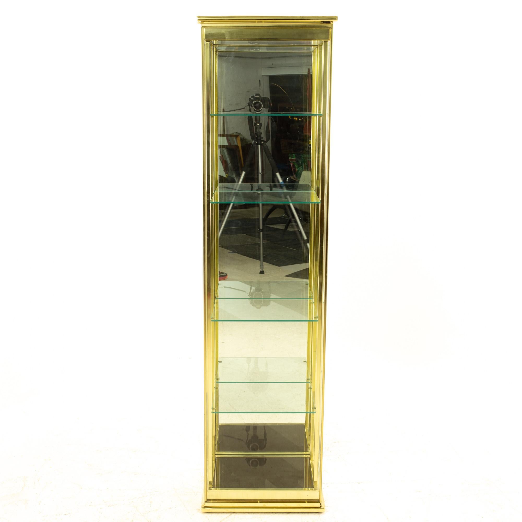 gold and glass display cabinet