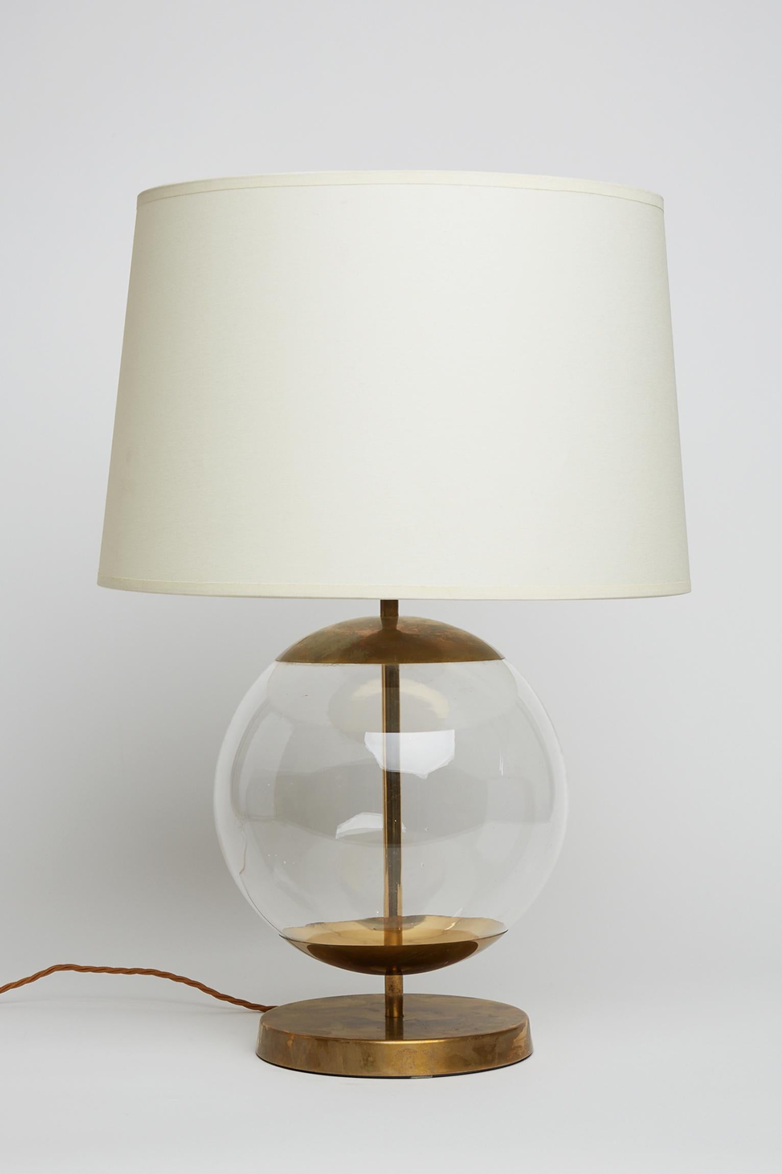 A brass and glass globe table lamp by Bergboms.
Sweden, Circa 1970.
With the shade: 60 cm high by 40 cm diameter.
Lamp base only: 40 cm high by 25 cm diameter.
