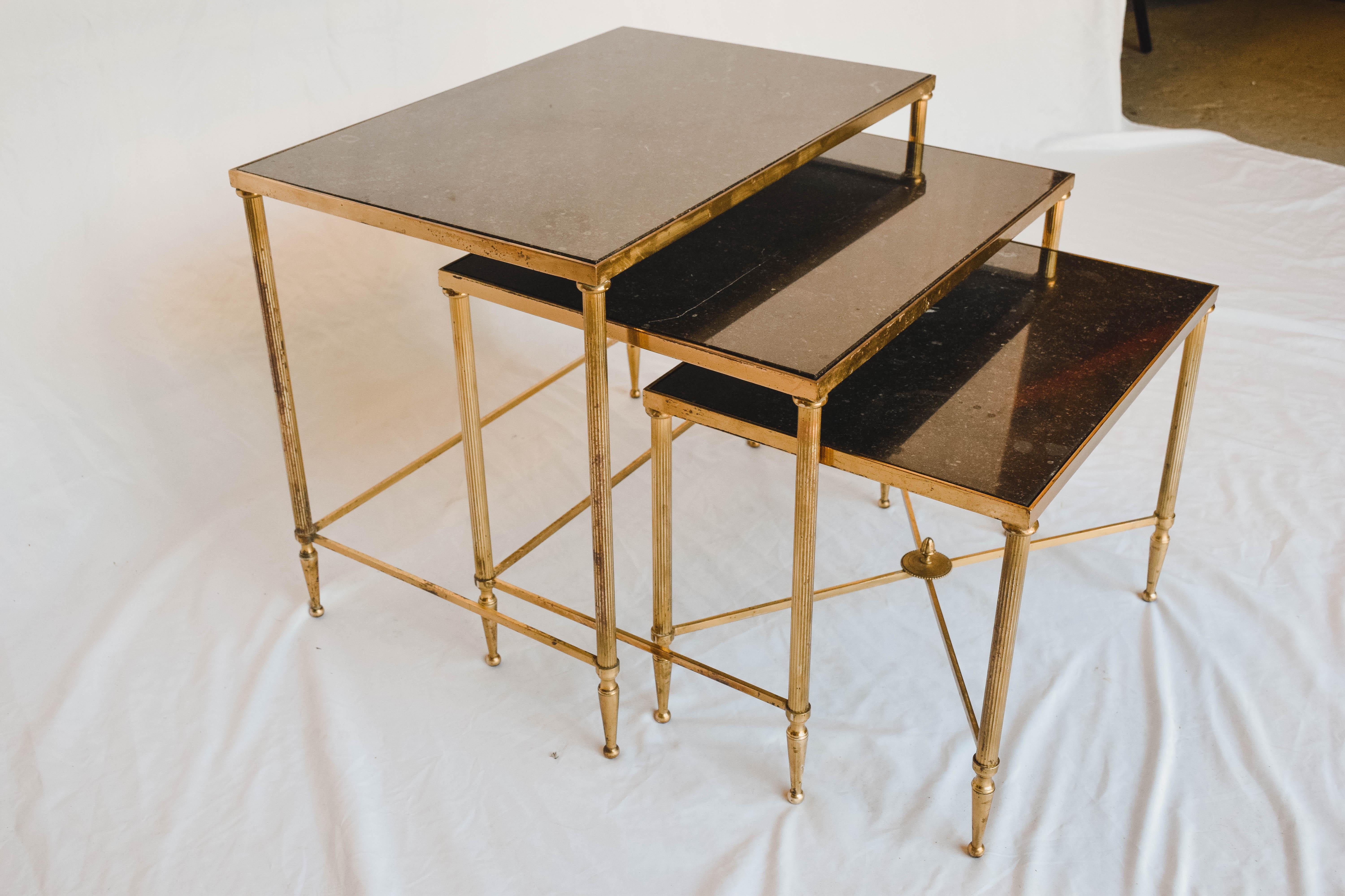 We found these wonderful French Mid-Century Modern nesting tables in Lyon France. This versatile set of three tables have beautiful black marble tops and brass frames.

Tables measure:
14 1/2