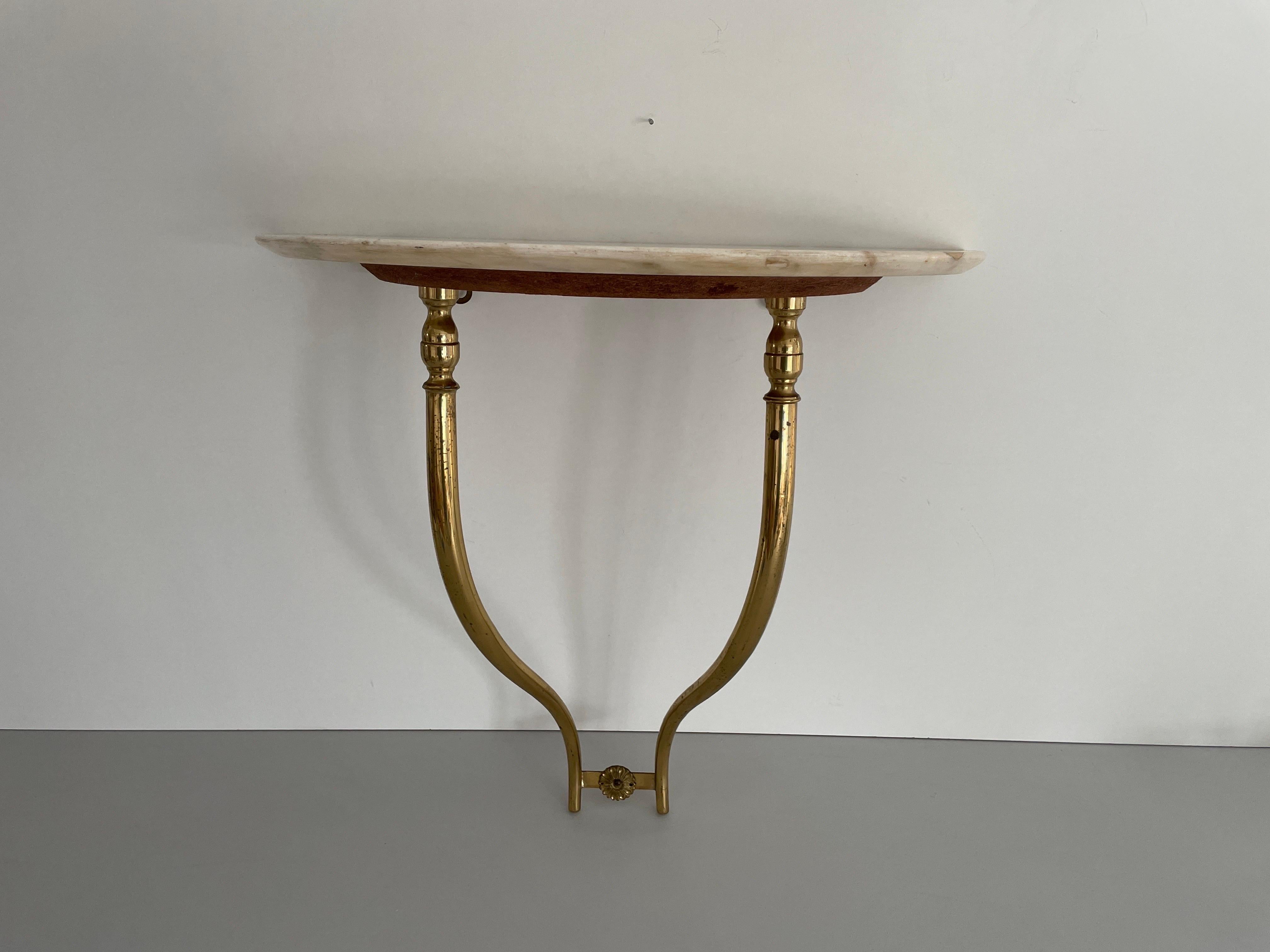 Mid-Century Brass and Marble Top Floating Wall Console Table, 1950s, Italy

No damage, no crack.
Wear consistent with age and use.

Measurements: 
Height: 48 cm
Width: 50 cm
Depth: 24 cm