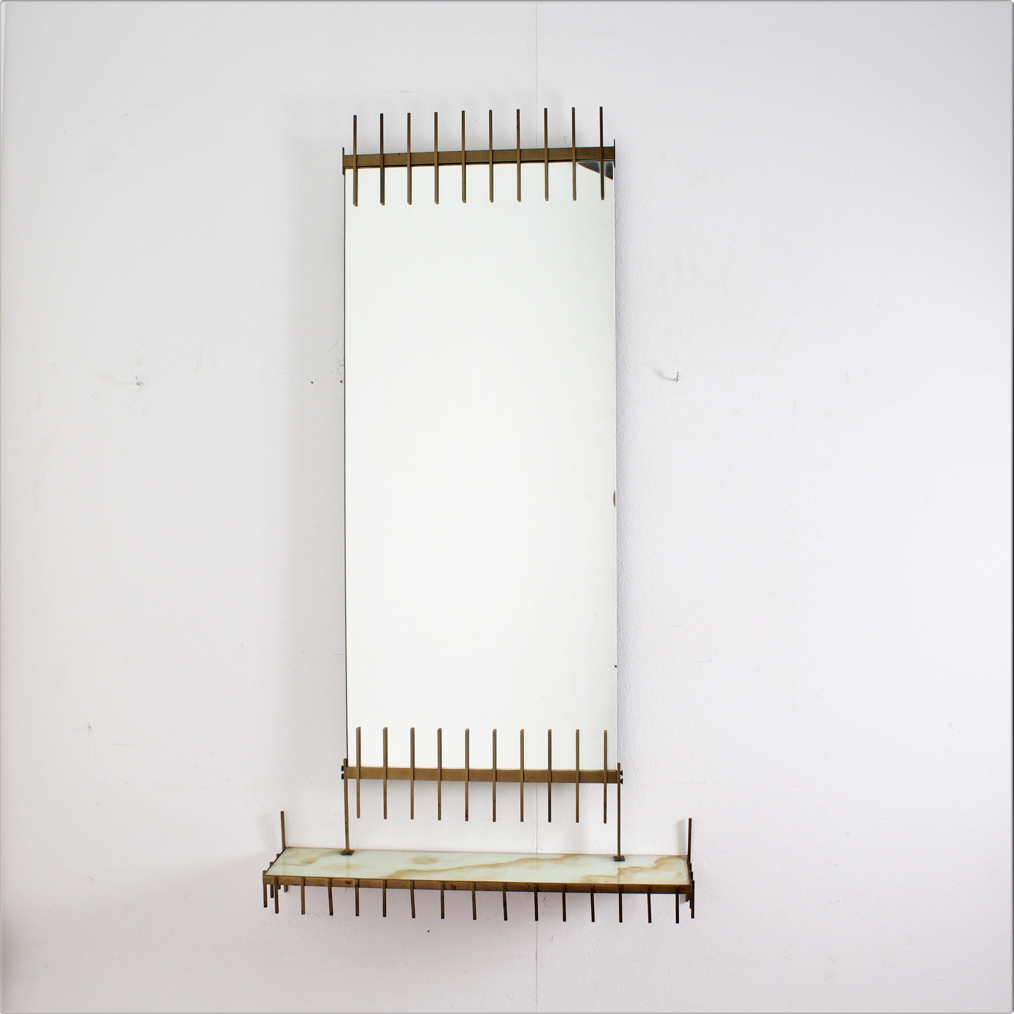 Rare and beautiful mirror console by Ettore Sottsass (1917-2007) for Sant'Ambrogio & de Berti, Italy, circa 1960.
Brass structure, mirror and marble glass shelf

Good condition, wear consistent with age and use.