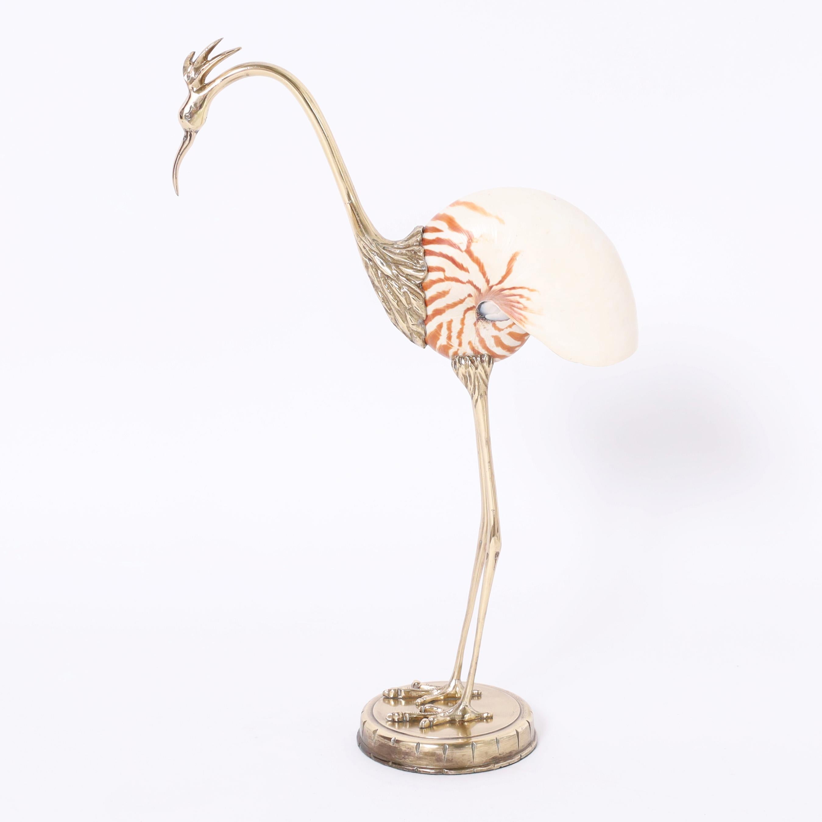 Vintage Italian Heron or Stork sculpture crafted in brass and featuring a nautilus shell body in the style of Binazzi.