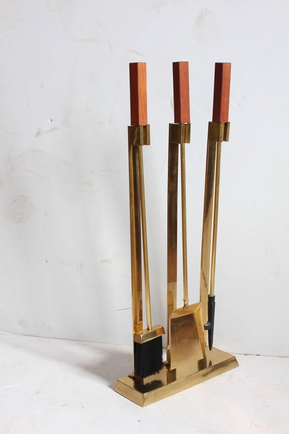 Midcentury brass and teak fire place tools.