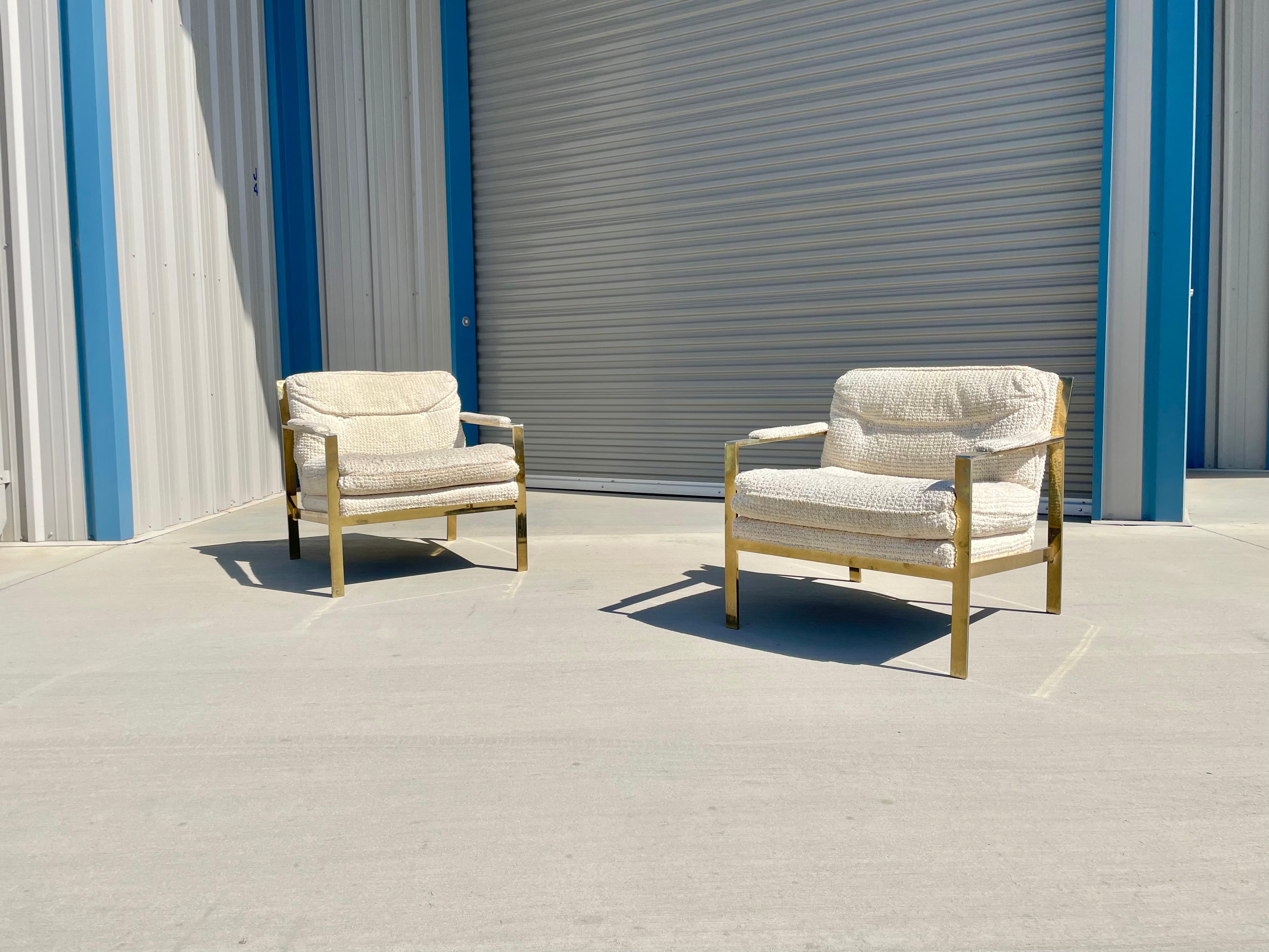Mid-century brass lounge chairs styled after Milo Baughman was designed and manufactured in the united states circa 1970s. The chairs feature a fully brass frame that stands out for their elegant architecture and sleek design. These chairs are also