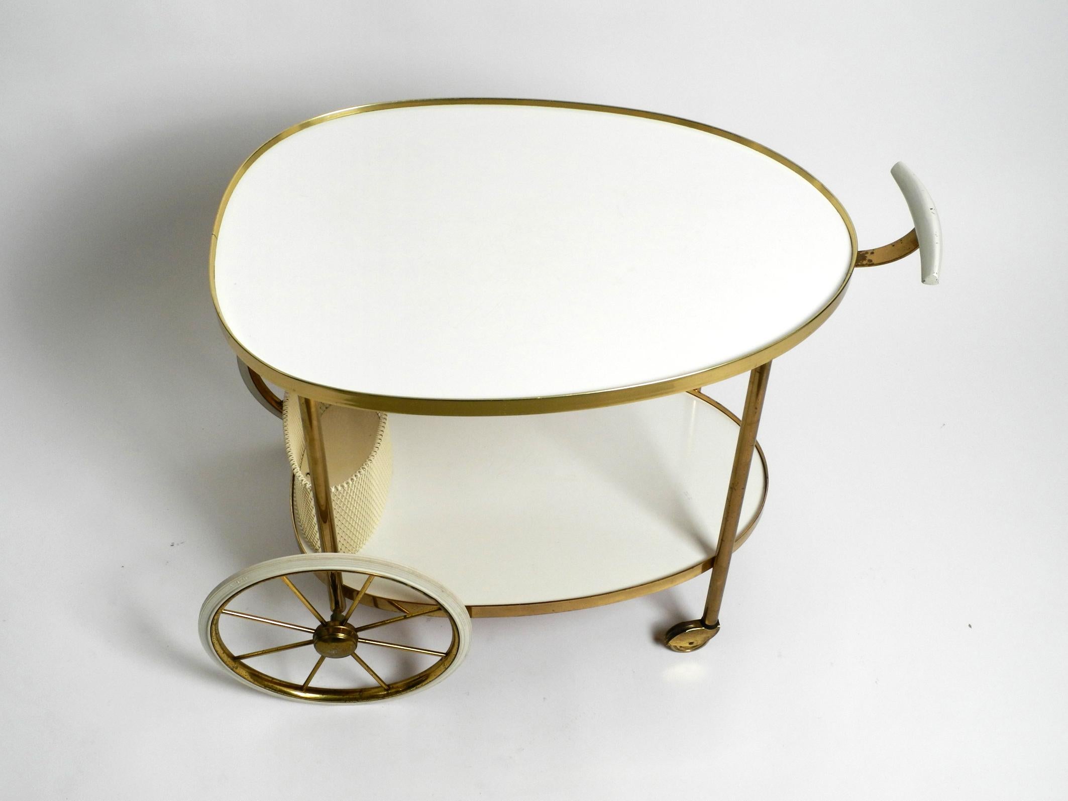 German Mid Century brass and wood serving trolley or bar cart by Vereinigte Werkstätten For Sale