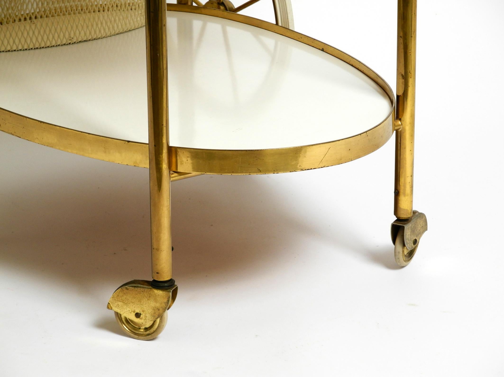 Mid Century brass and wood serving trolley or bar cart by Vereinigte Werkstätten For Sale 1