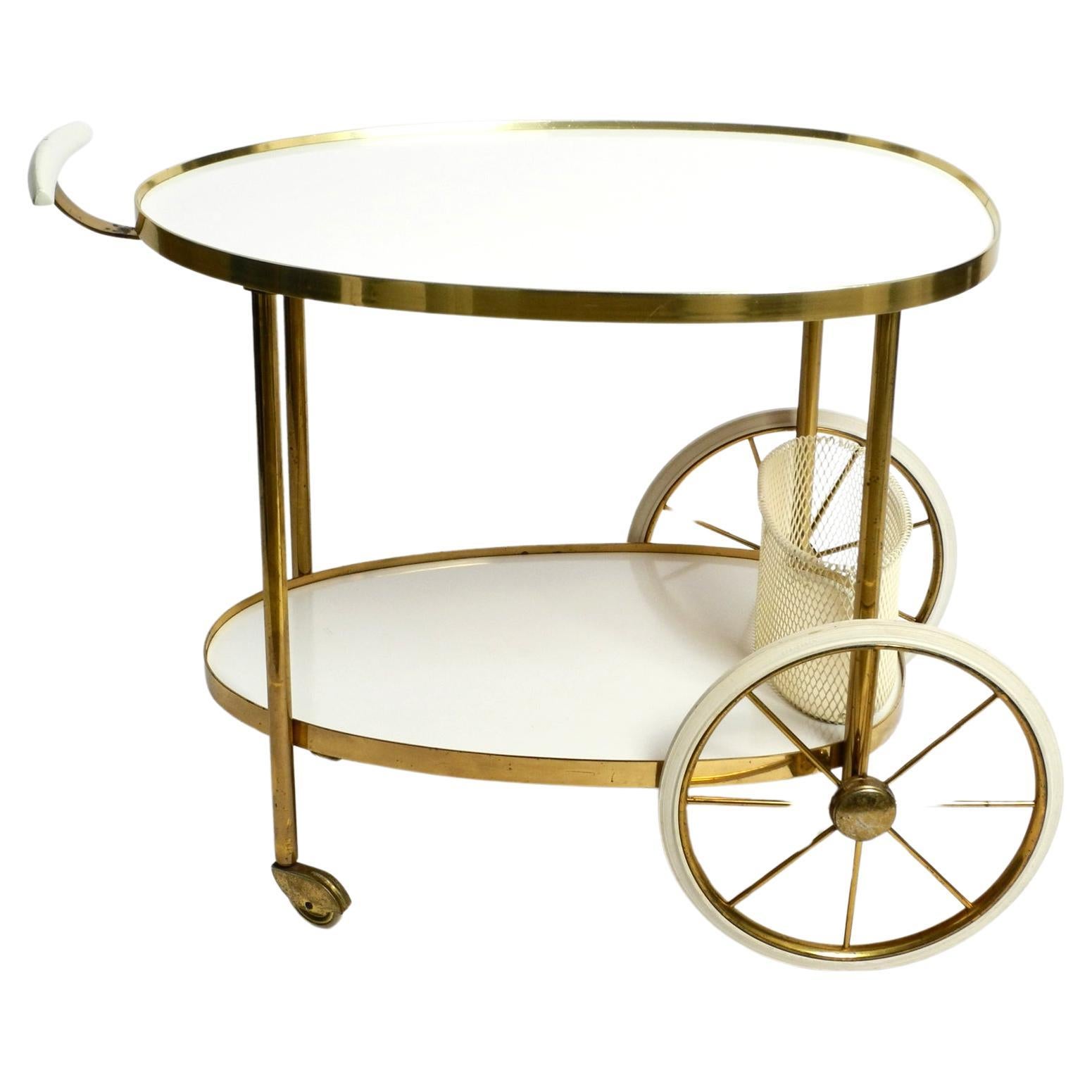 Mid Century brass and wood serving trolley or bar cart by Vereinigte Werkstätten For Sale