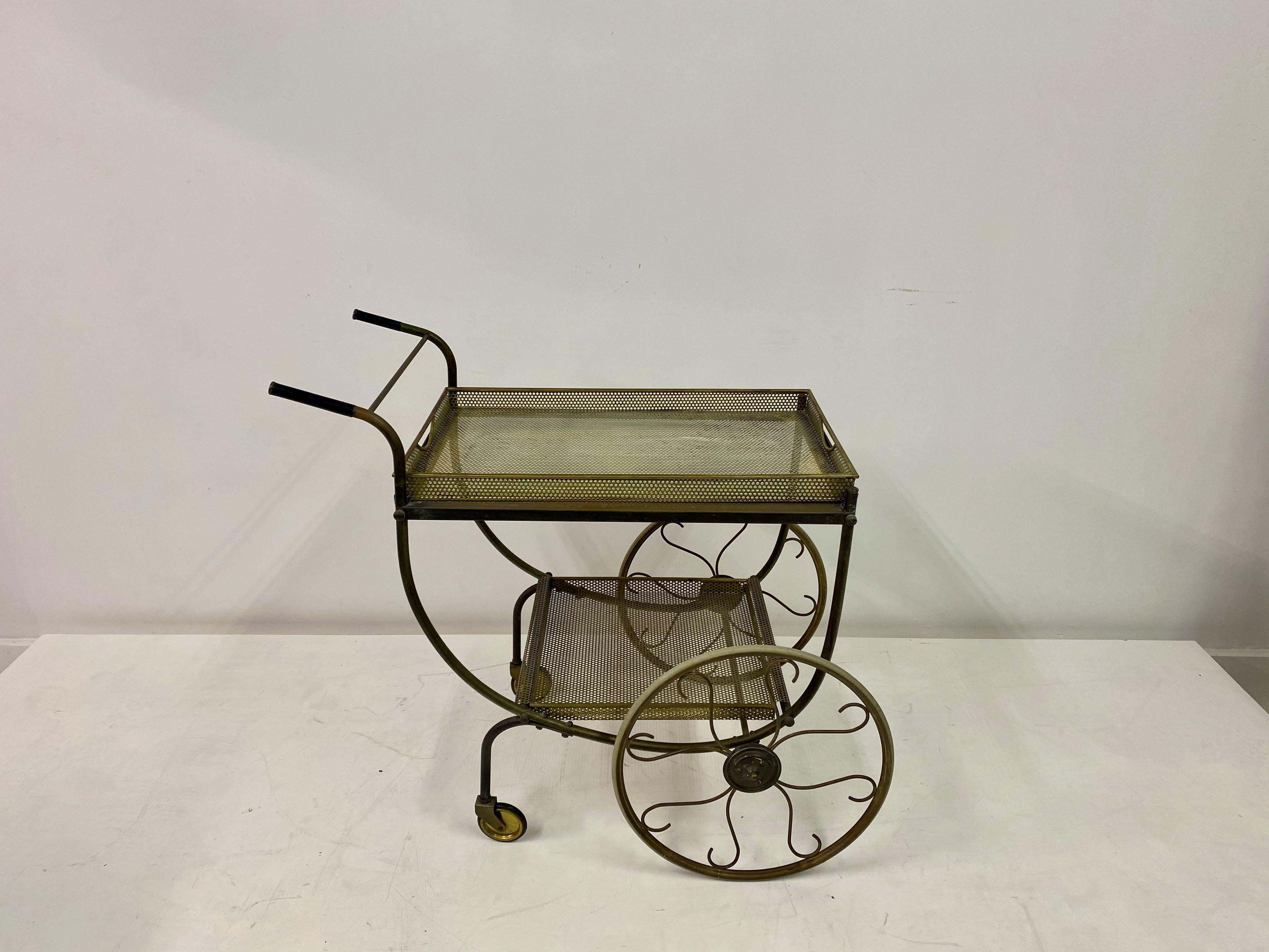 Brass drinks trolley

Perforated metal trays

Removable trays

Rubber rimmed wheels

Two large wheels and two small

Brass remains unpolished

1950s Sweden.



 