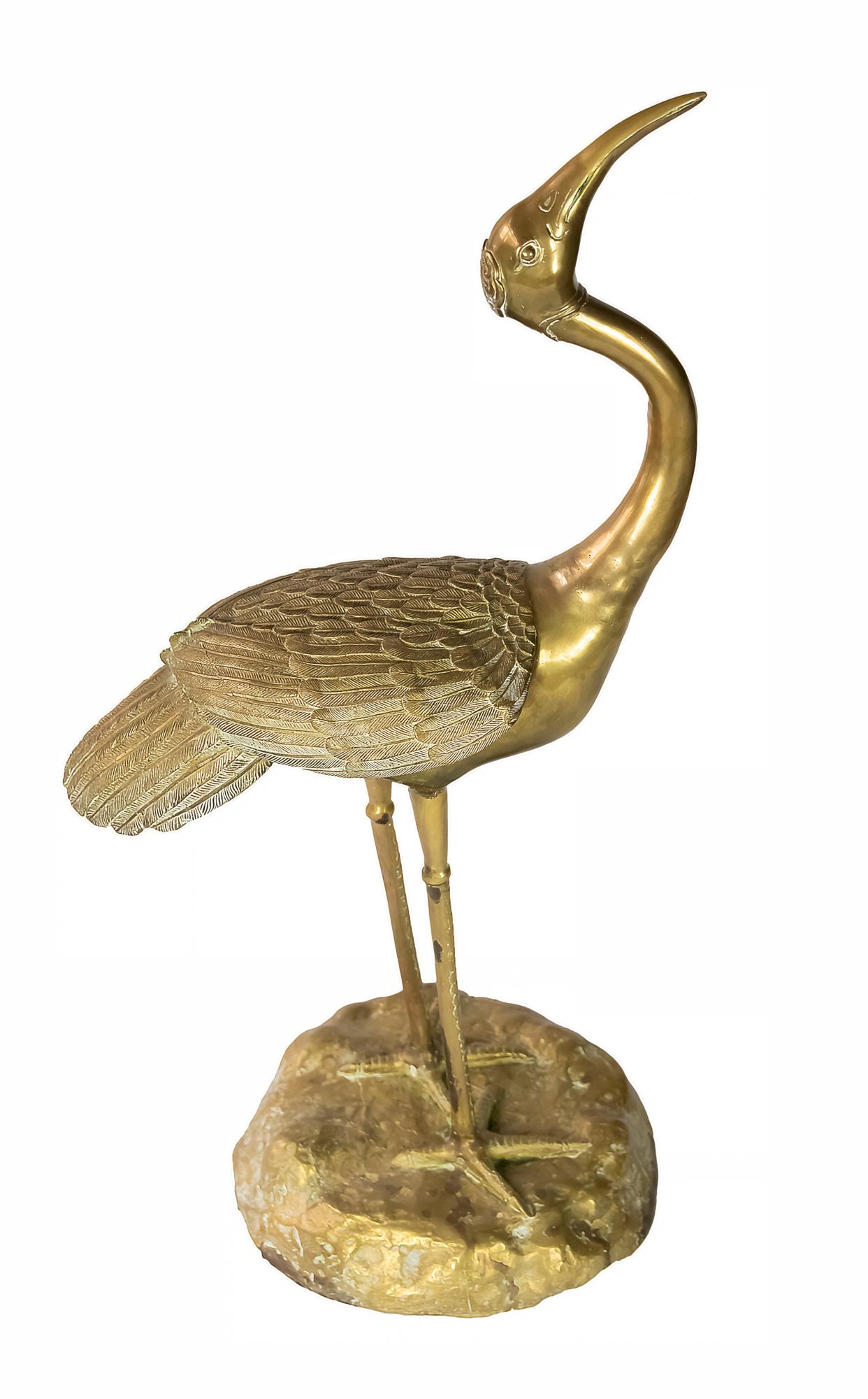 Mid-century heavy and solid brass bird sculpture.