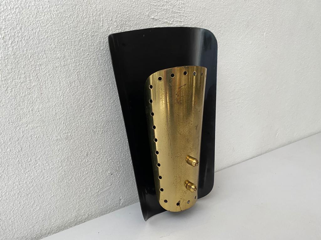 Mid century brass & black metal sconce by Karl Walther Nache, 1950s Germany

Very rare high quality wall lamp.

Frame are made of metal. Cover is made of brass.

Lamp is in very good vintage condition.

This lamp works with E14 standard