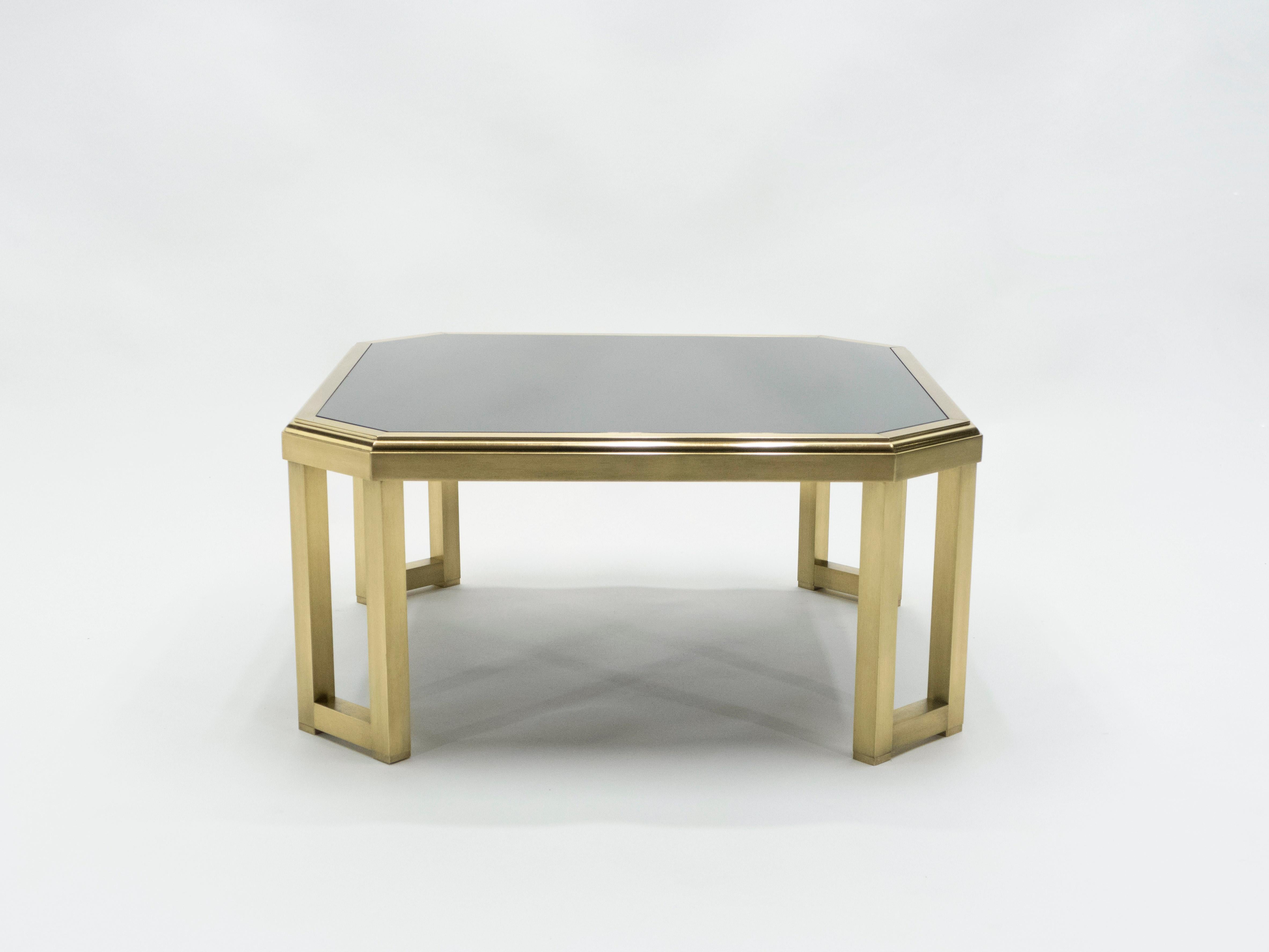 This table’s beautiful, polished brass base and feet reflect the Chinese-inspired design that dominated many creations by Maison Jansen. Mid-Century Modern elements like sleek, clean lines are given an ornamental flare, with a brand new black