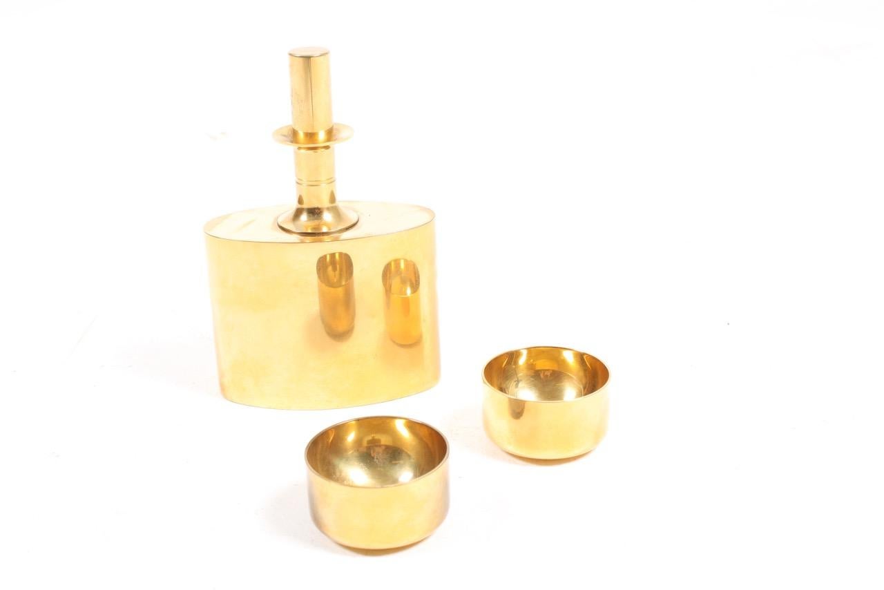 Set of bottle and 2 glasses in brass designed by Pierre Forssell and made by Skultuna in Finland.
