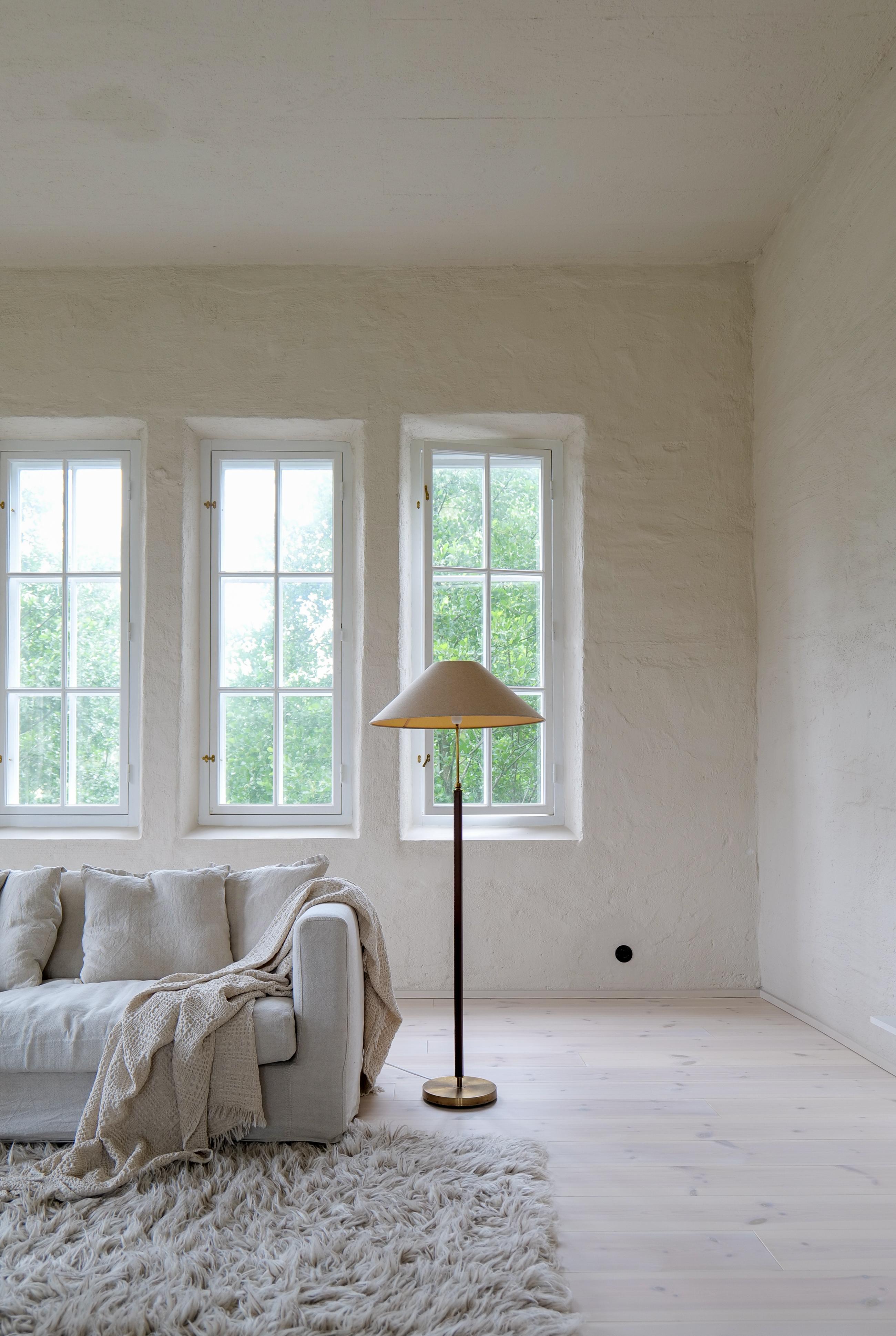 This lamp was made in Sweden at Falkenbergs Belysning. Wonderful, assembled brass combination with leather rod. The brass working well together with the brown stitched leather.

Good patinated brass with stains and small dents, working condition.