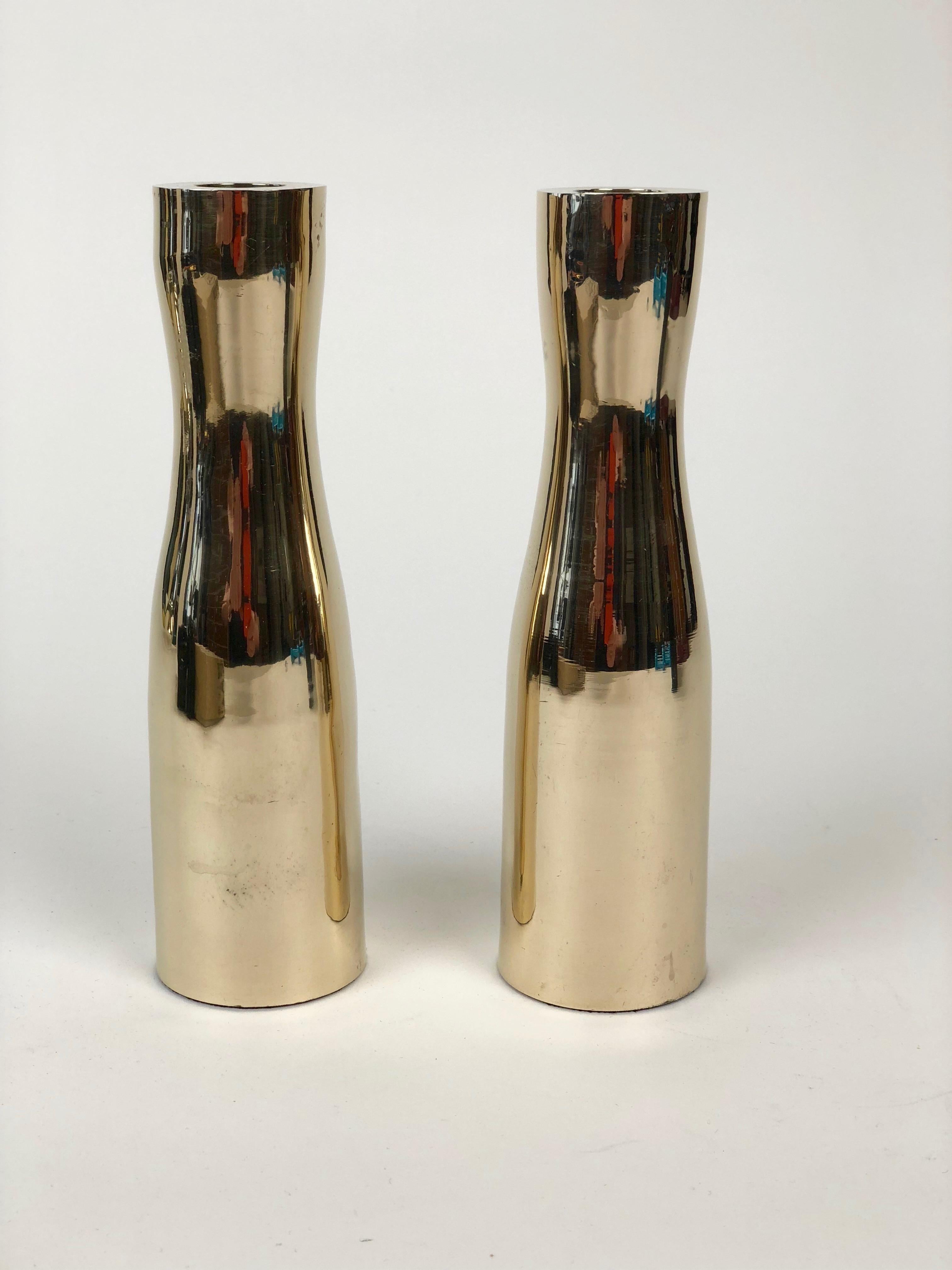 These candleholders are composed of minimalistic forms that are made in solid brass. They have been polished to a high sheen.

The candleholders were made in the 1960s and were produced in the USA. The price is for two pieces, sold as set.