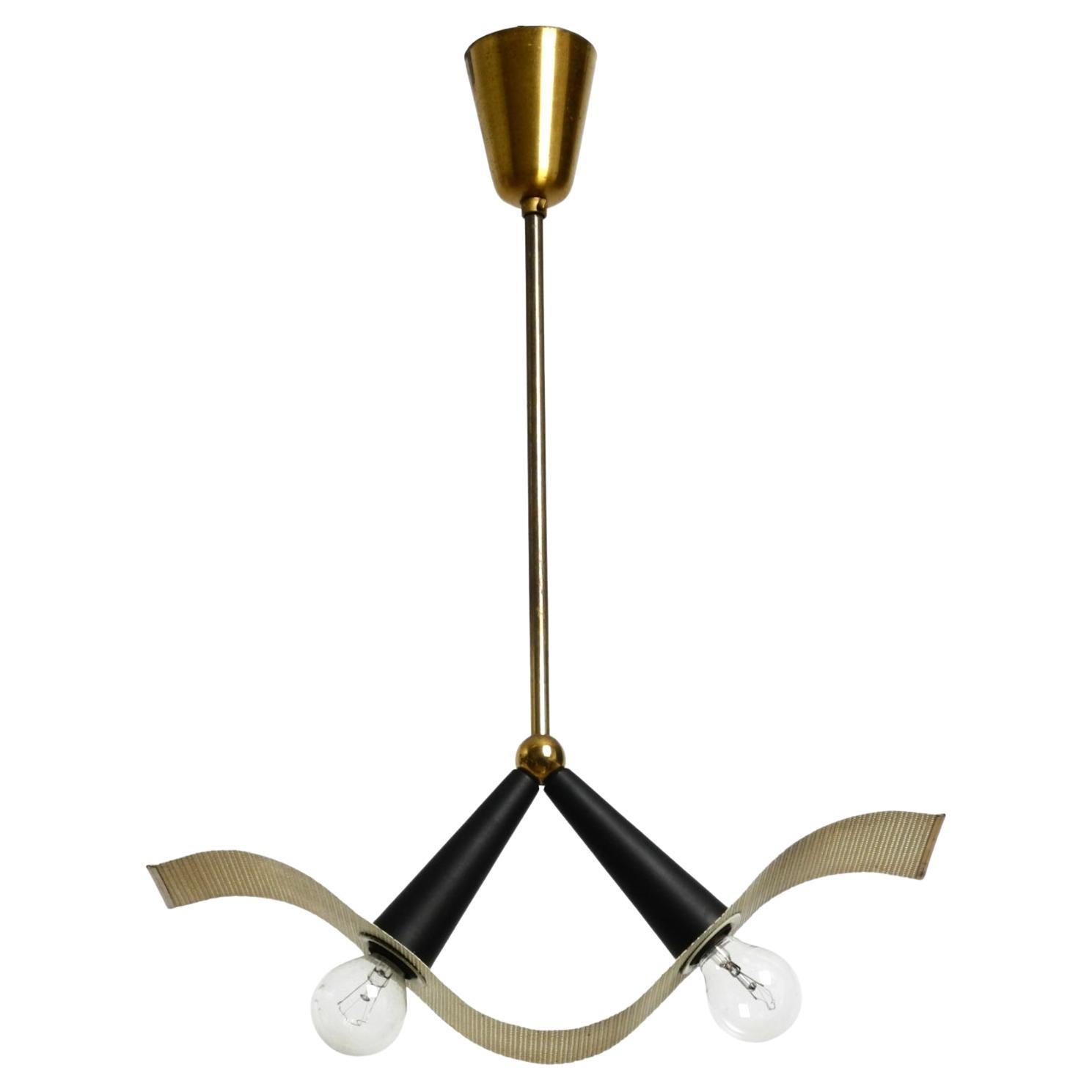 Mid Century brass ceiling cone lamp with a curved perforated sheet lampshade