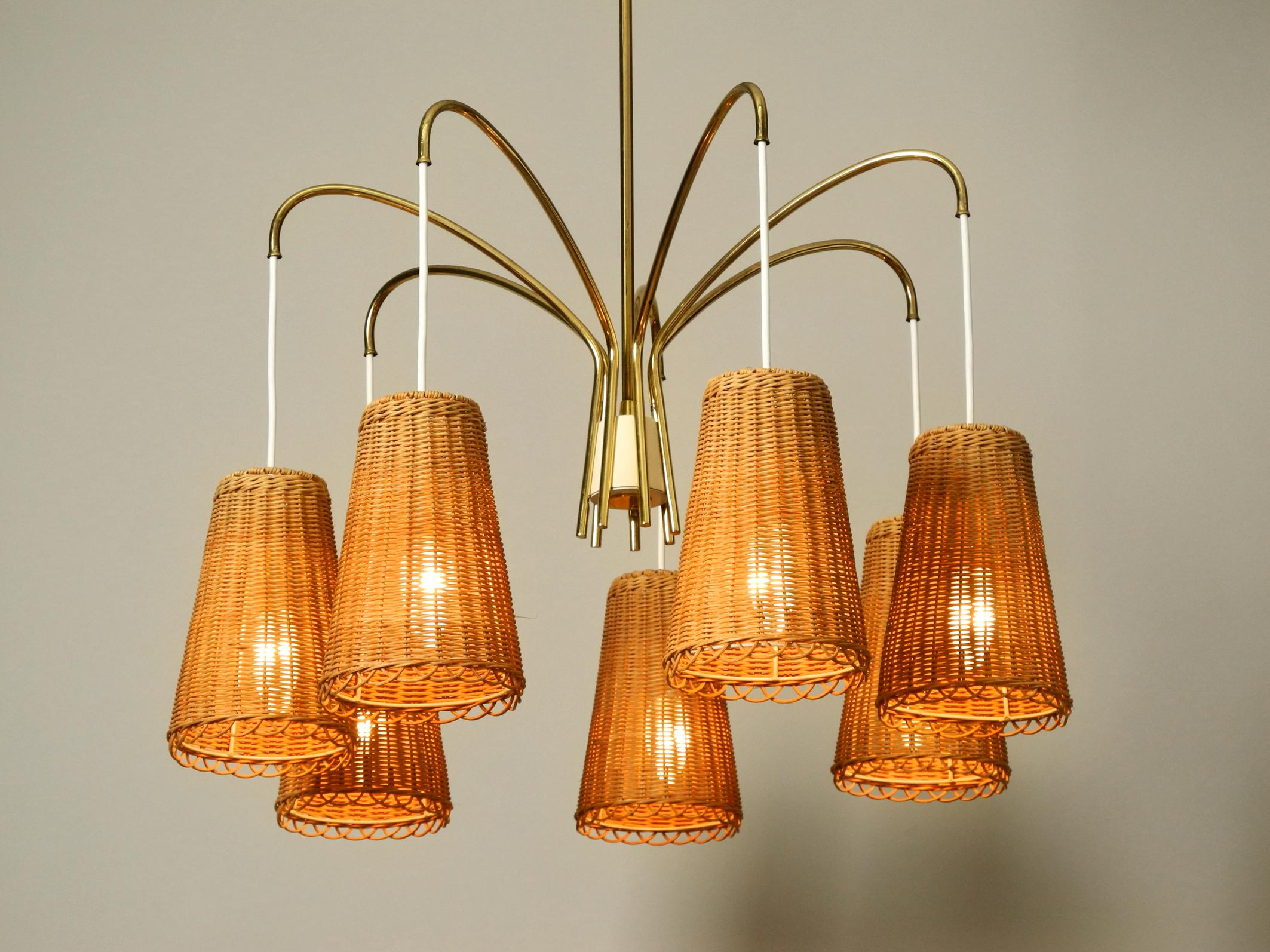 Beautiful rare midcentury brass ceiling lamp with seven basket shades.
Made by the Vereinigten Werkstätten. Made in Germany.
Very elegant Minimalist design in very good vintage condition.
Creates a very warm indirect pleasant light.
Without