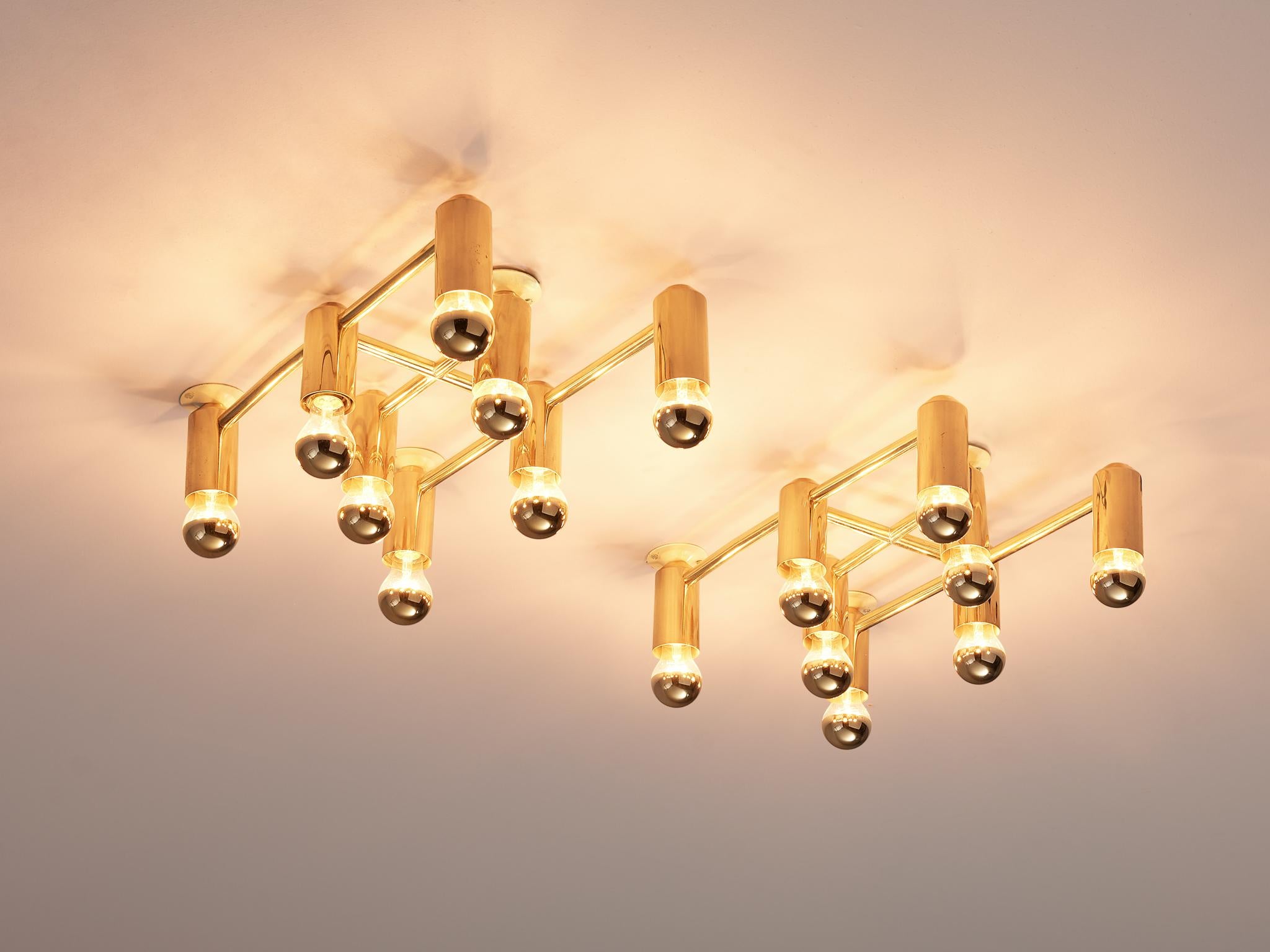 Ceiling lights, brass and glass, Europe, 1960s

This set of delicate ceiling lights are minimalist yet warm. Each light consists of eight light bulbs that are placed in three rows of which the middle section holds only two and the outer three. The