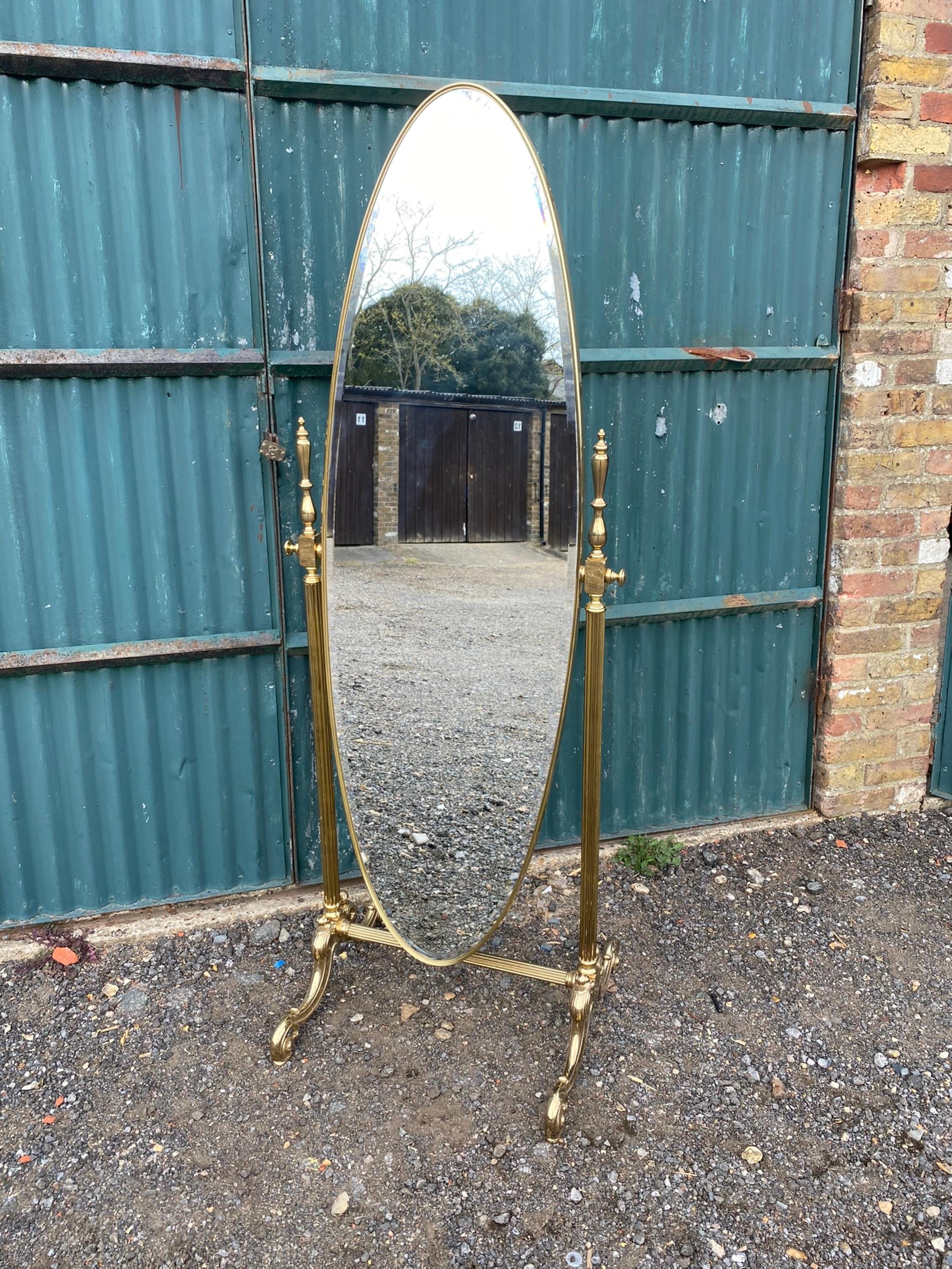 Mid Century Brass Cheval mirror, Italian, 1970s

Magnificent large brass frame cheval mirror having an oval mirror supported by heavily decorated cast brass frame on feet. The brass framed bevelled mirror tilts in frame to adjust position.

Italian,