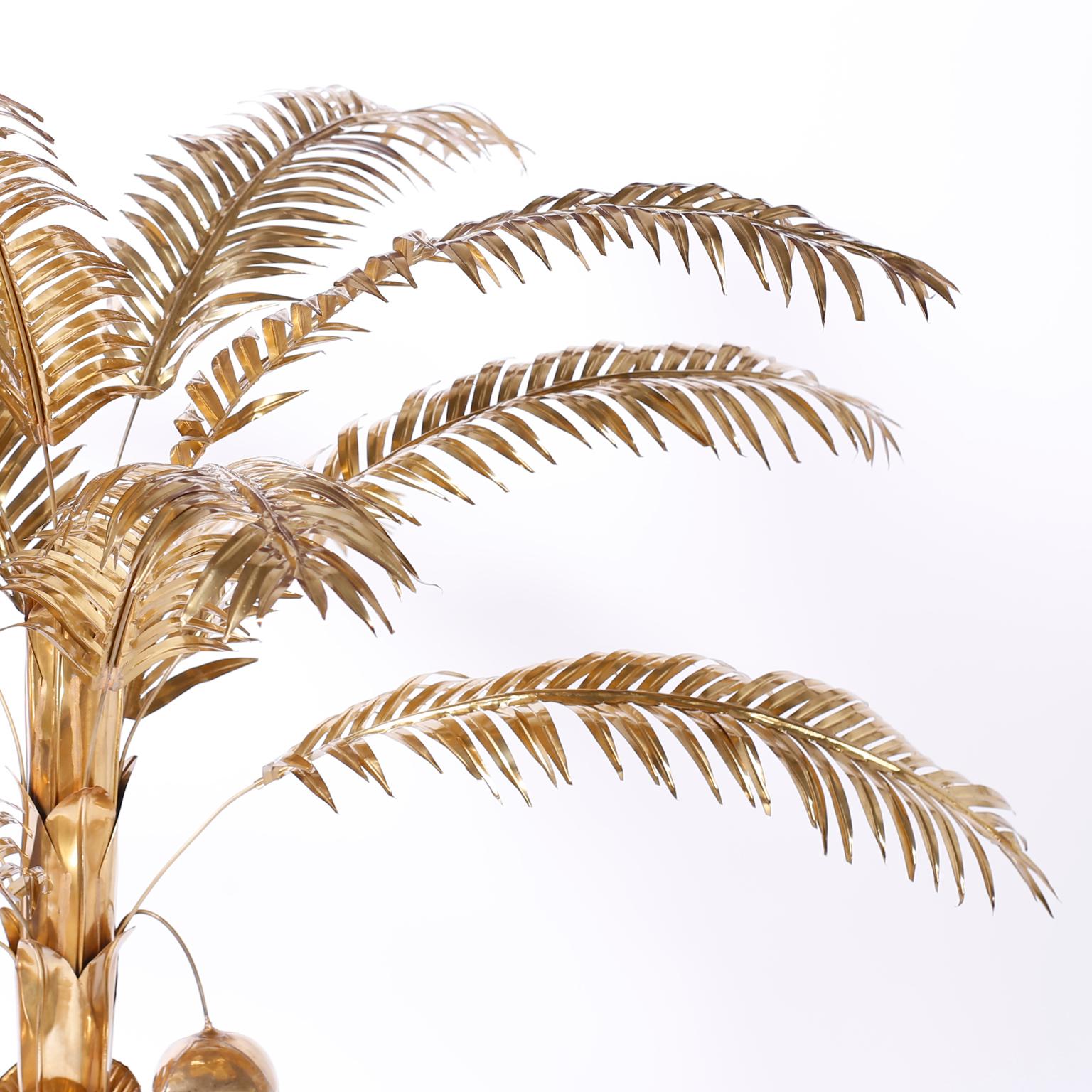 Chic midcentury stylized palm tree with removable fronds, coconuts, reticulated trunk and a round weighted base. Hand polished and lacquered for easy care.