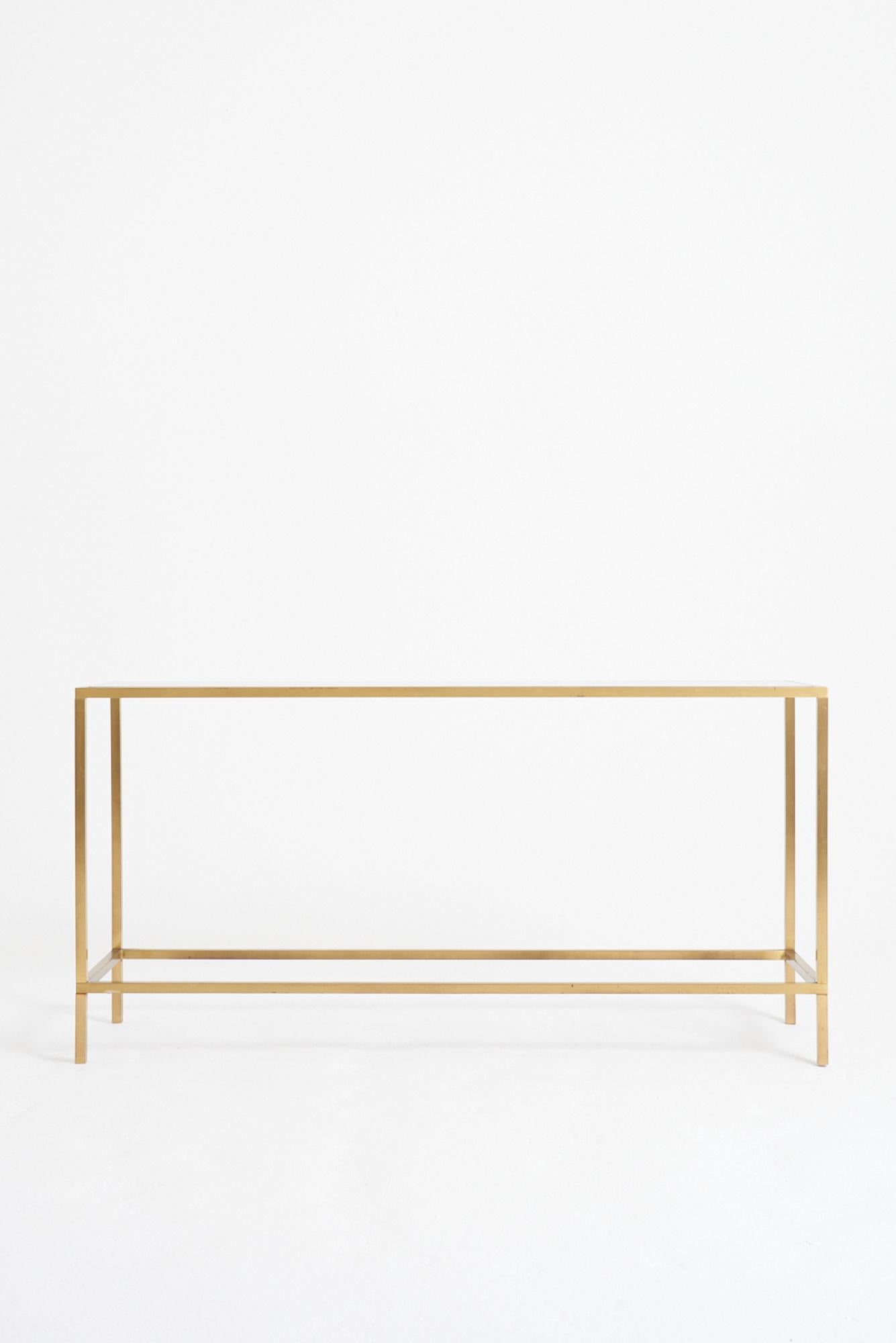 A brass and glass top console table
France, Circa 1970
