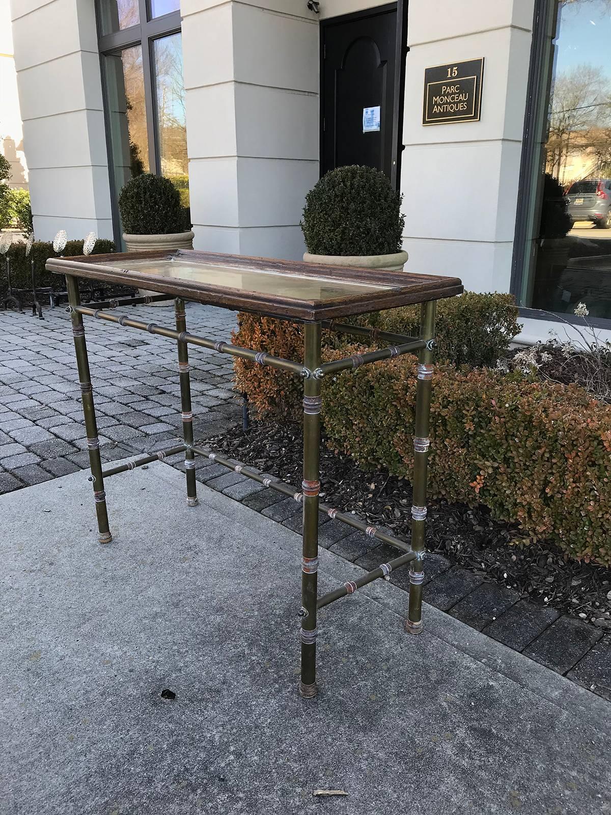 Midcentury brass console with wood.