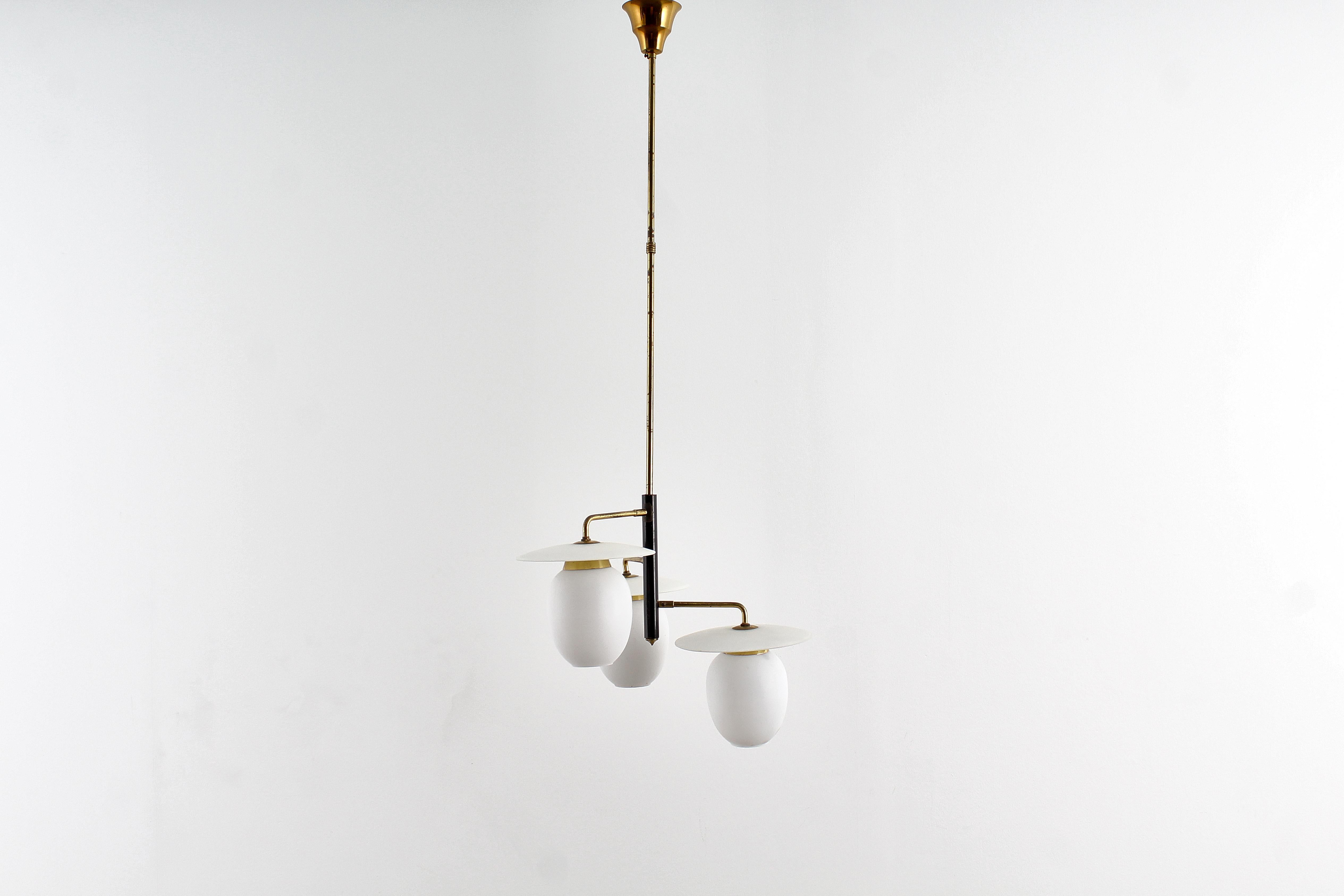 Stilish Glass and brass chandelier. Italian production, 1950s.
Where consistent with age and use.