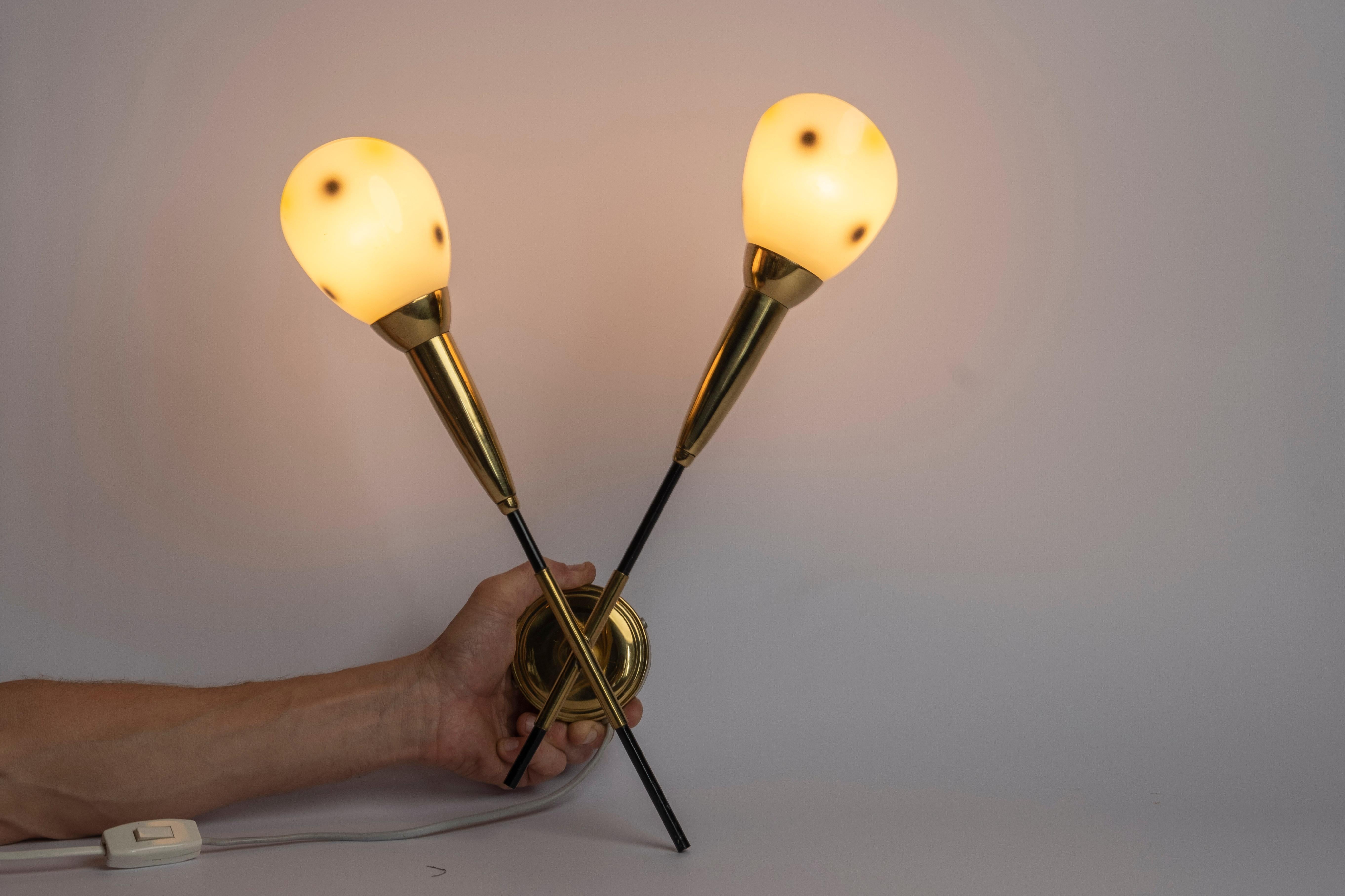 Double headed wall lamp, of brass and opaline glass. Produced in Norway, 1950s.