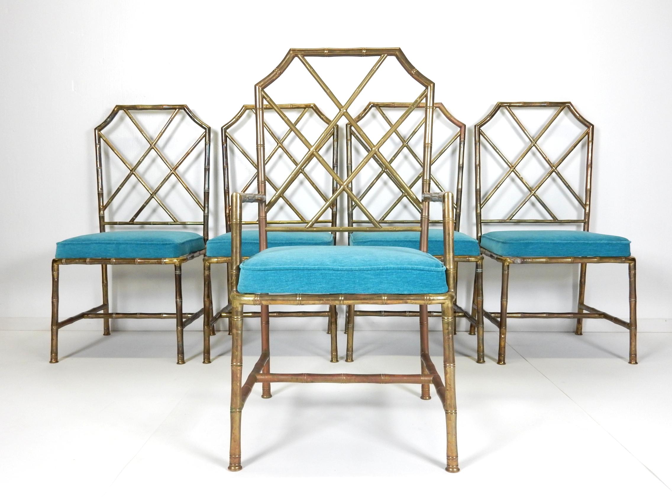 Set of 5 (one arm and four sides) faux bamboo brass dining chairs
with new teal upholstered seat cushions.
Chippendale style design, circa 1970s.
Lots of age and tarnish on brass.