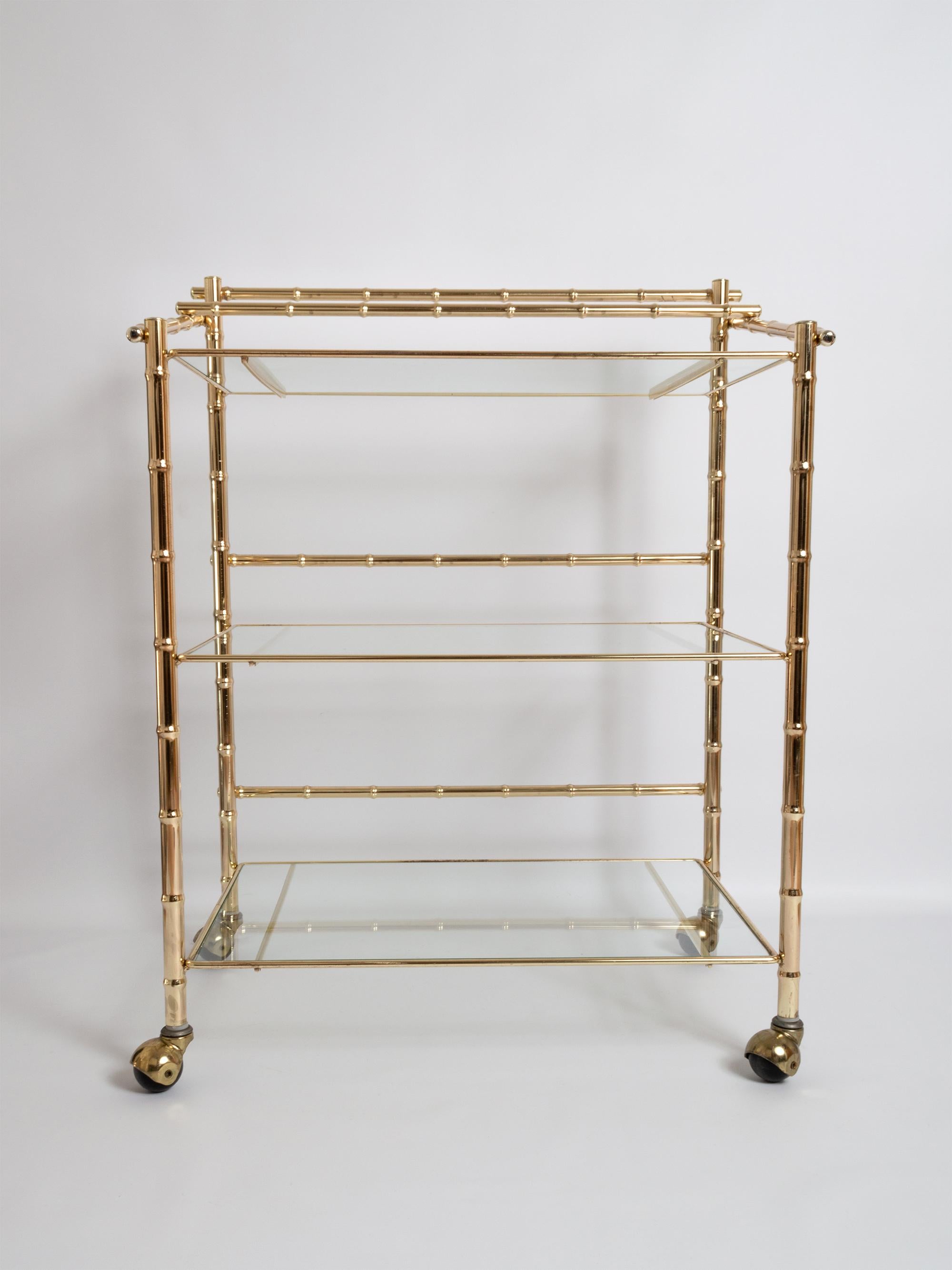 A Mid Century Gold Brass Bar Cart Drinks Trolley Étagère, France, C1960.

In excellent vintage condition commensurate of age.
 