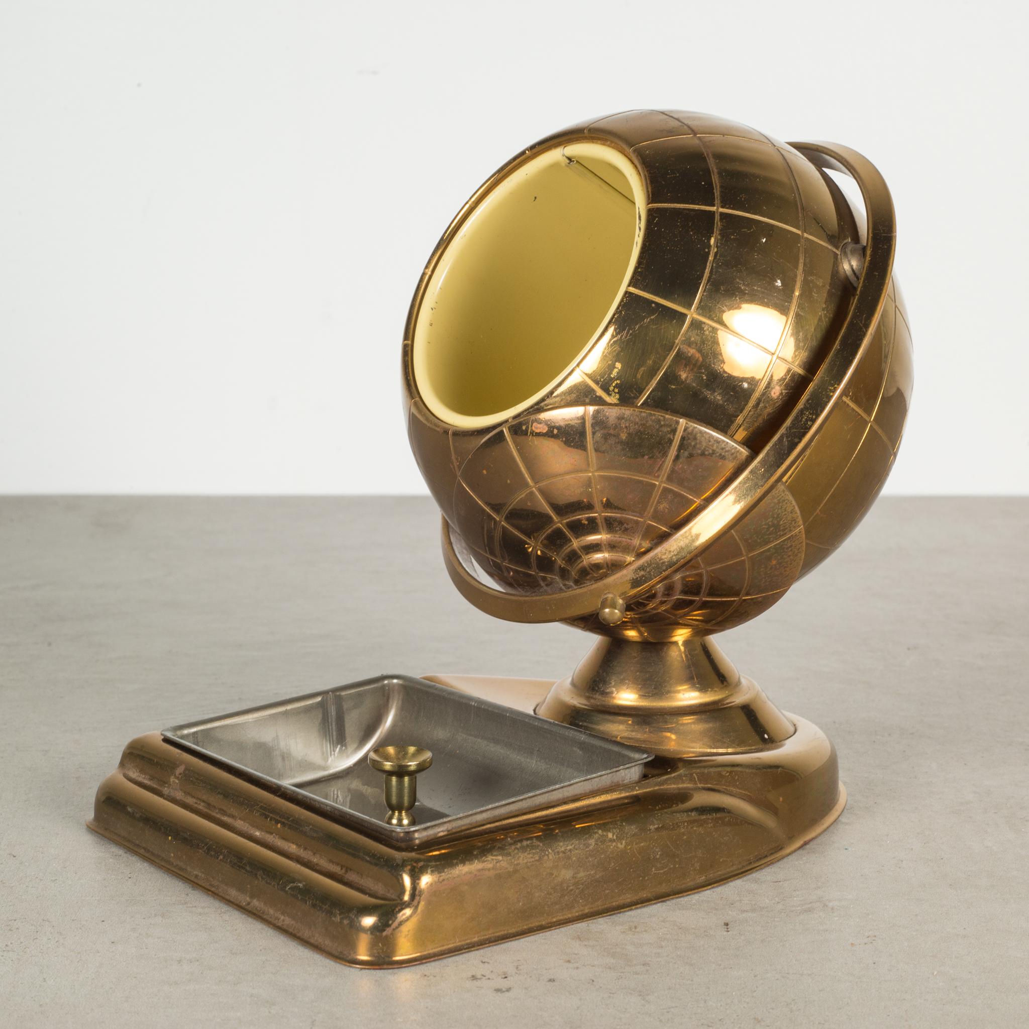 About

An original mid-century brass cigarette holder and ashtray or coin dish. The lid slides open on the globe's axis to reveal a metal interior designed to hold cigarettes. This globe is unique because it has an attached tray.

Creator: