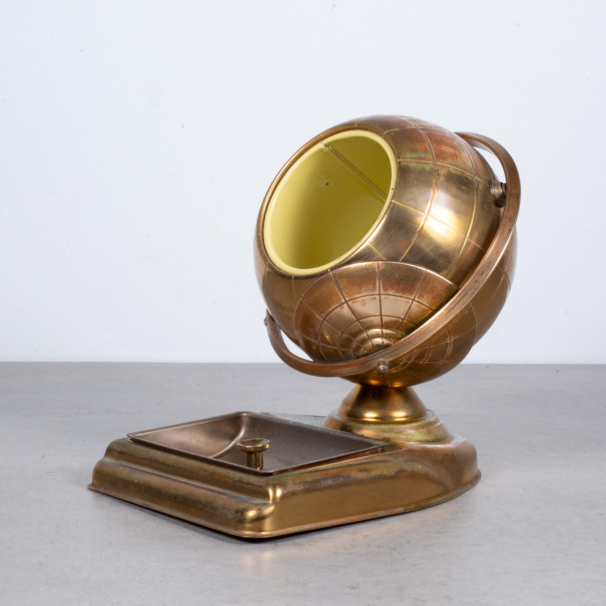 ABOUT

An original midcentury brass cigarette holder and ashtray or coin dish. The lid slides open on the globe's axis to reveal a metal interior designed to hold cigarettes. This globe is unique because it has an attached tray.

 CREATOR: