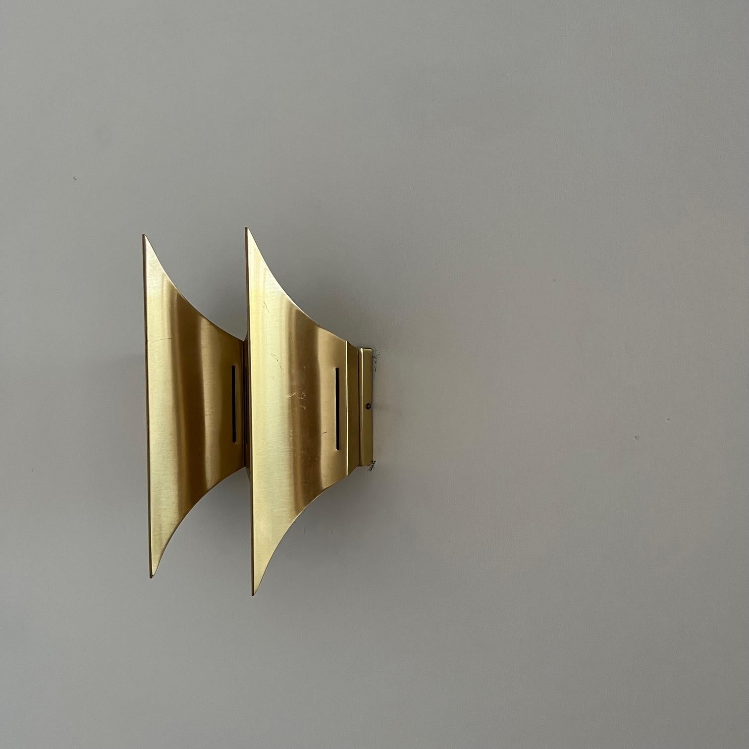 Brass wall lights by Bent Karlby for Lyfa.

Gothic II model.

Denmark, c1960s.

Three available at the time of listing.

PRICED AND SOLD INDIVIDUALLY. 

Re-wired and PAT tested.

Good vintage condition generally, one has a slight bent to