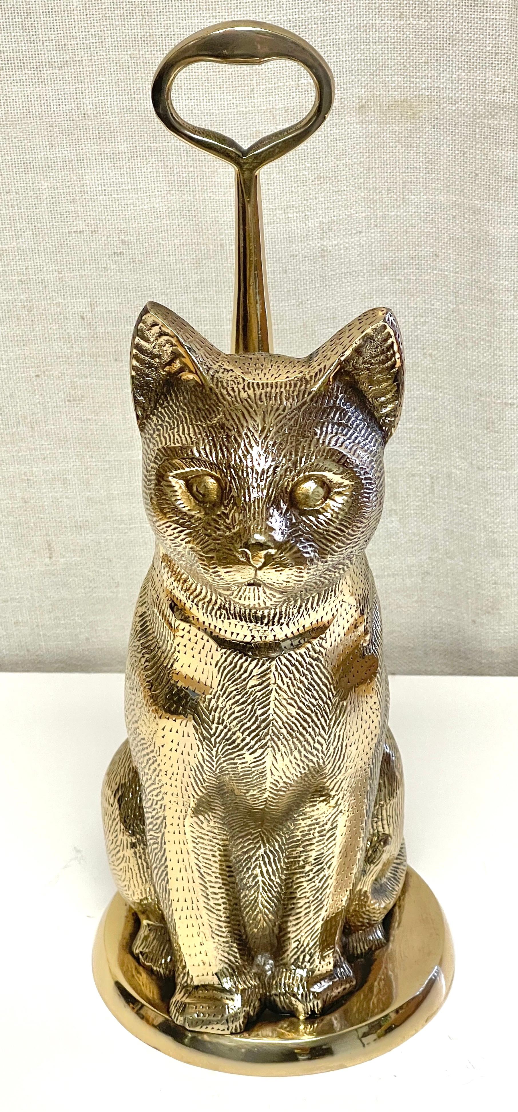 Mid-Century brass handled cat doorstop, by Sarreid Ltd.
Spain, Circa 1970s

A rare and unique model, by famed the Sarreid Ltd. foundry. 
The well thought out design, complete with the raised column oval handle, supporting the seated