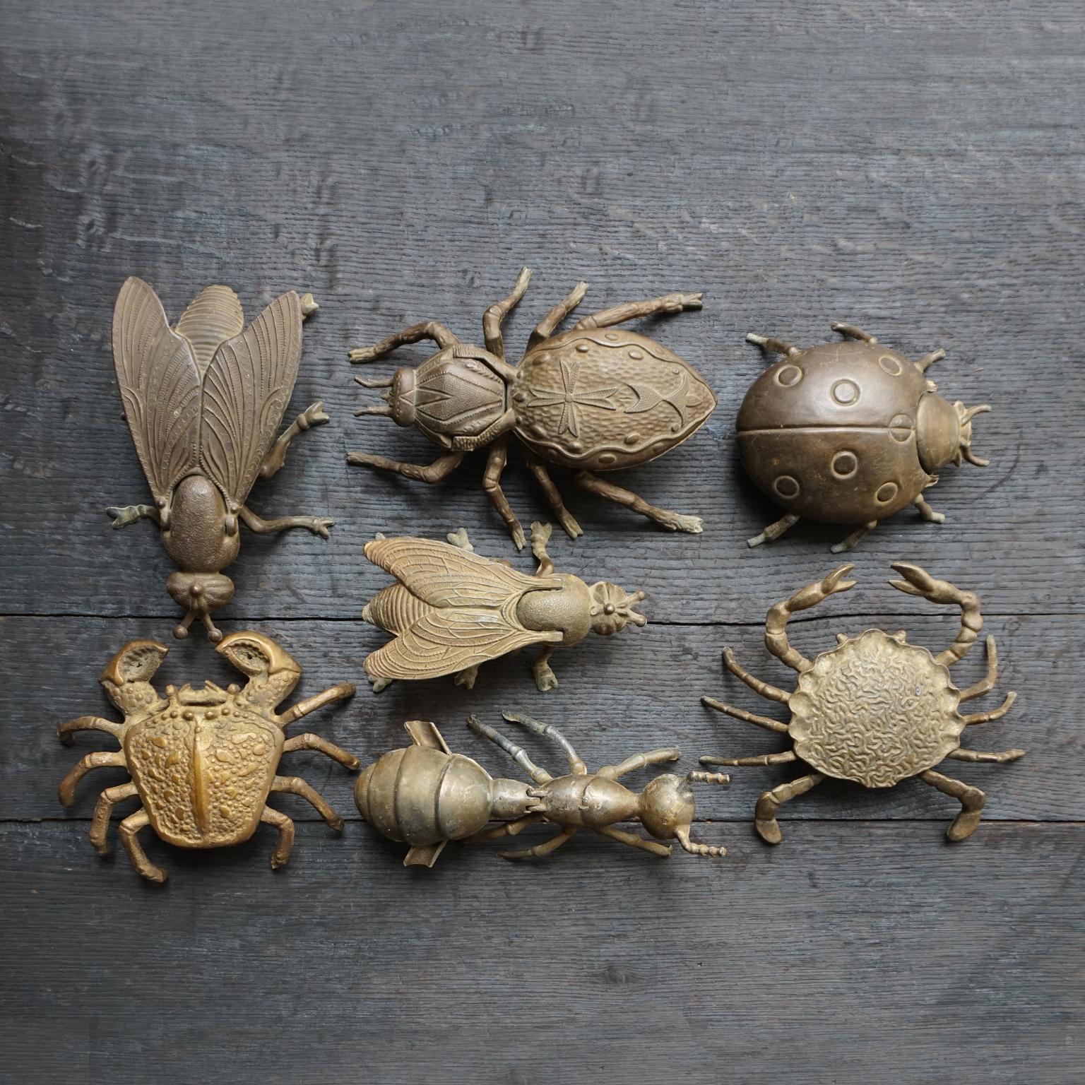 Set of seven detailed vintage 1960s-1970s large scale metal brass trinket dishes or ashtrays.
Two flies, two crabs, an ant, a ladybug and a spider.

Measurements L x W x H:
Spider 19 x 15 x 6 cm (7.5